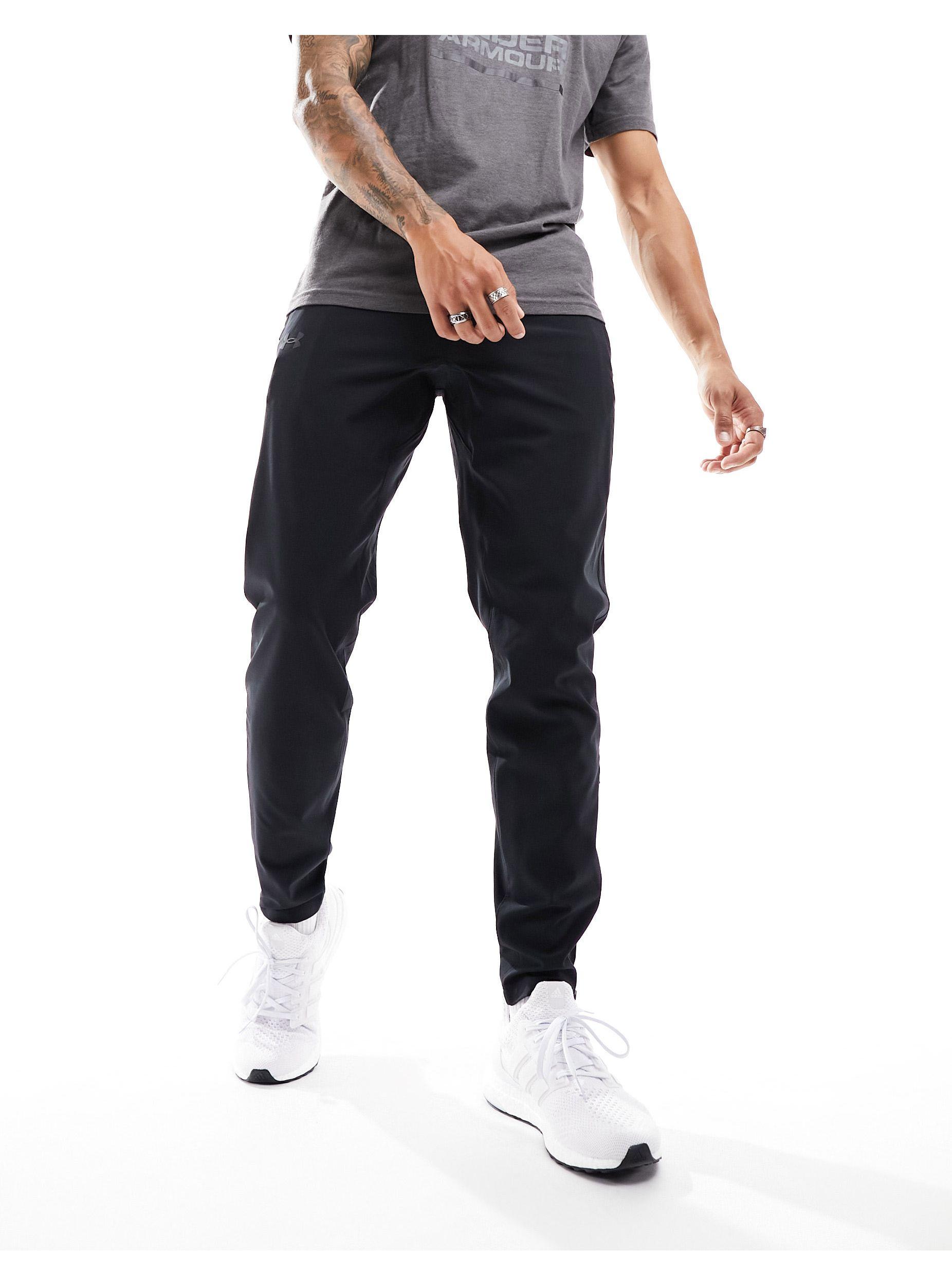 Under Armour Running Storm joggers with side logo in black
