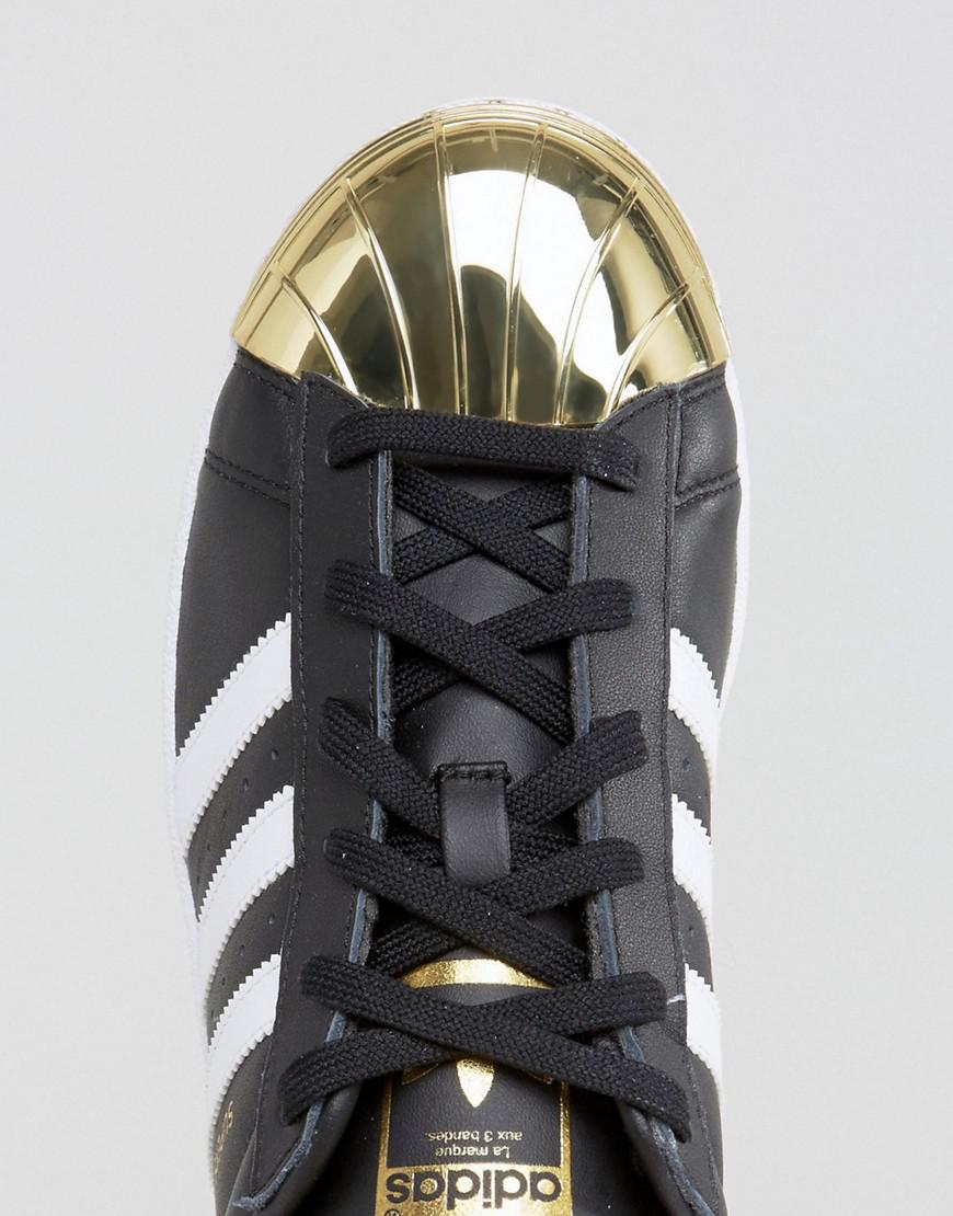 adidas Originals Originals Black Superstar Sneakers With Gold Metal Toe Cap  | Lyst