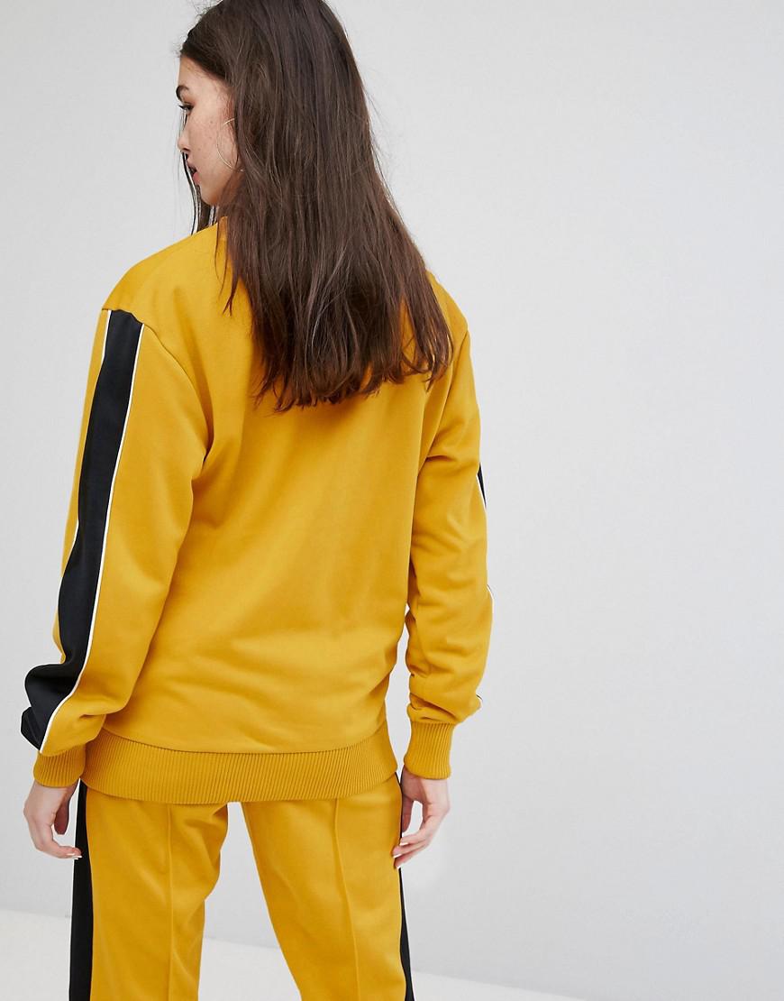 yellow tracksuit black stripe