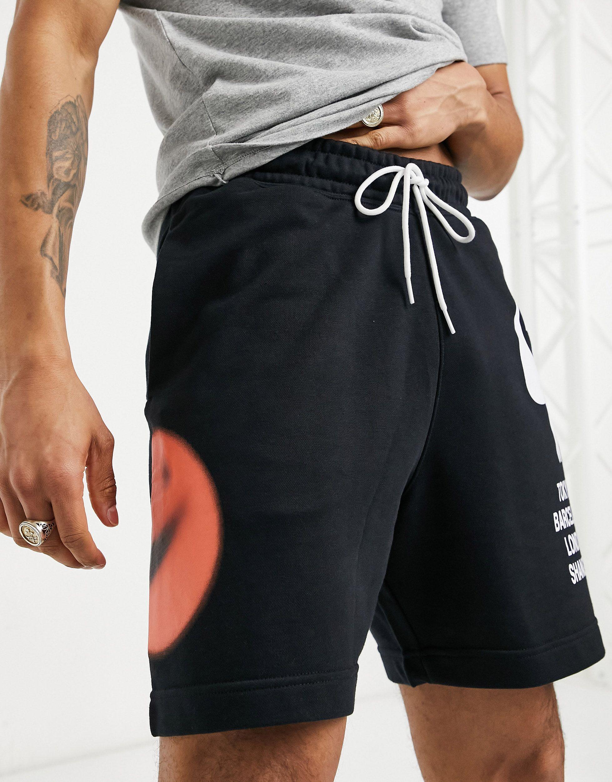 nike world tour pack graphic shorts in black