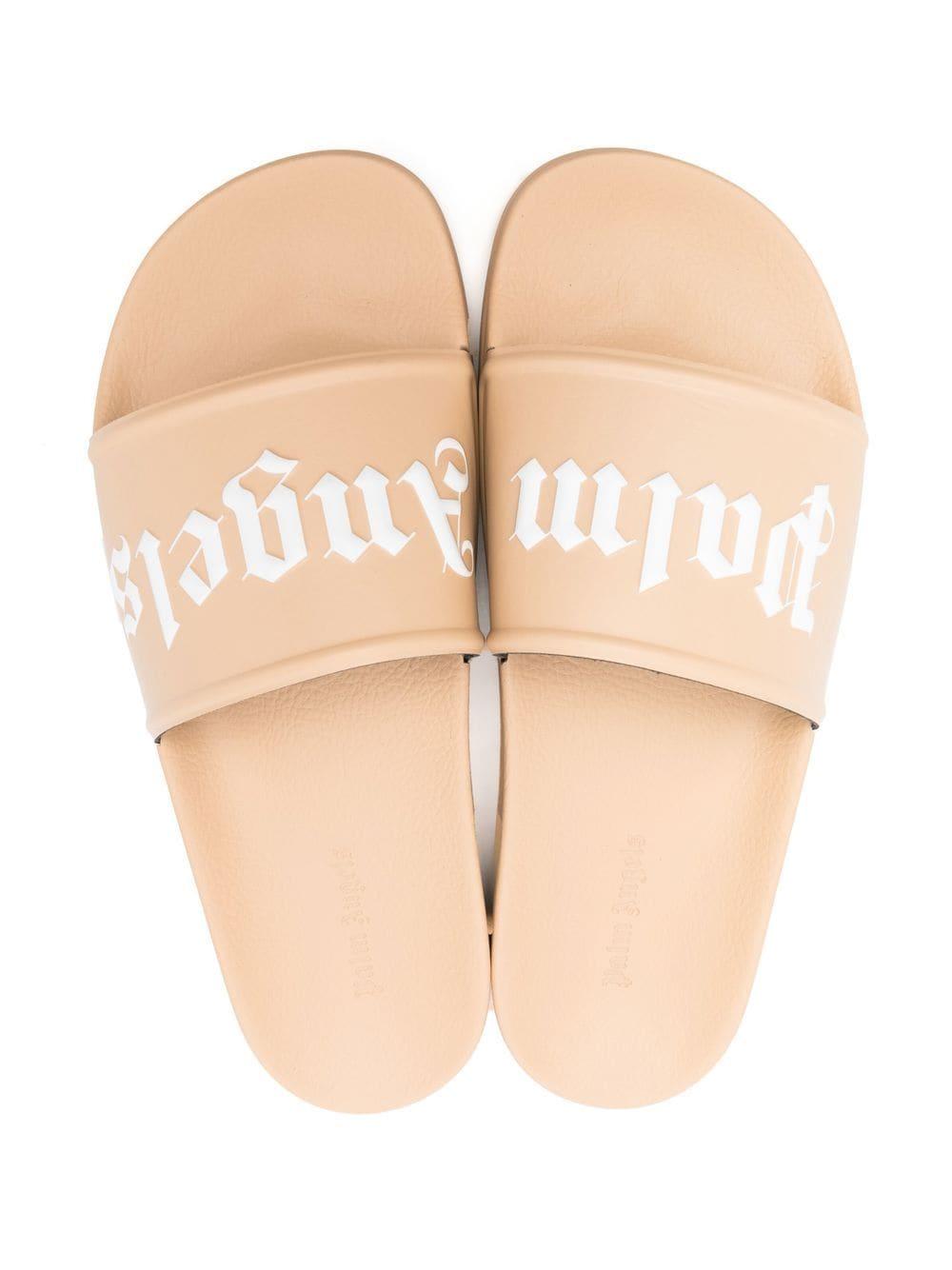 slides and flip flops Palm Angels Sandals Pink slides and flip flops Palm Angels Pool Logo Rubber Slide Sandals in Beige/White for Men Mens Sandals 