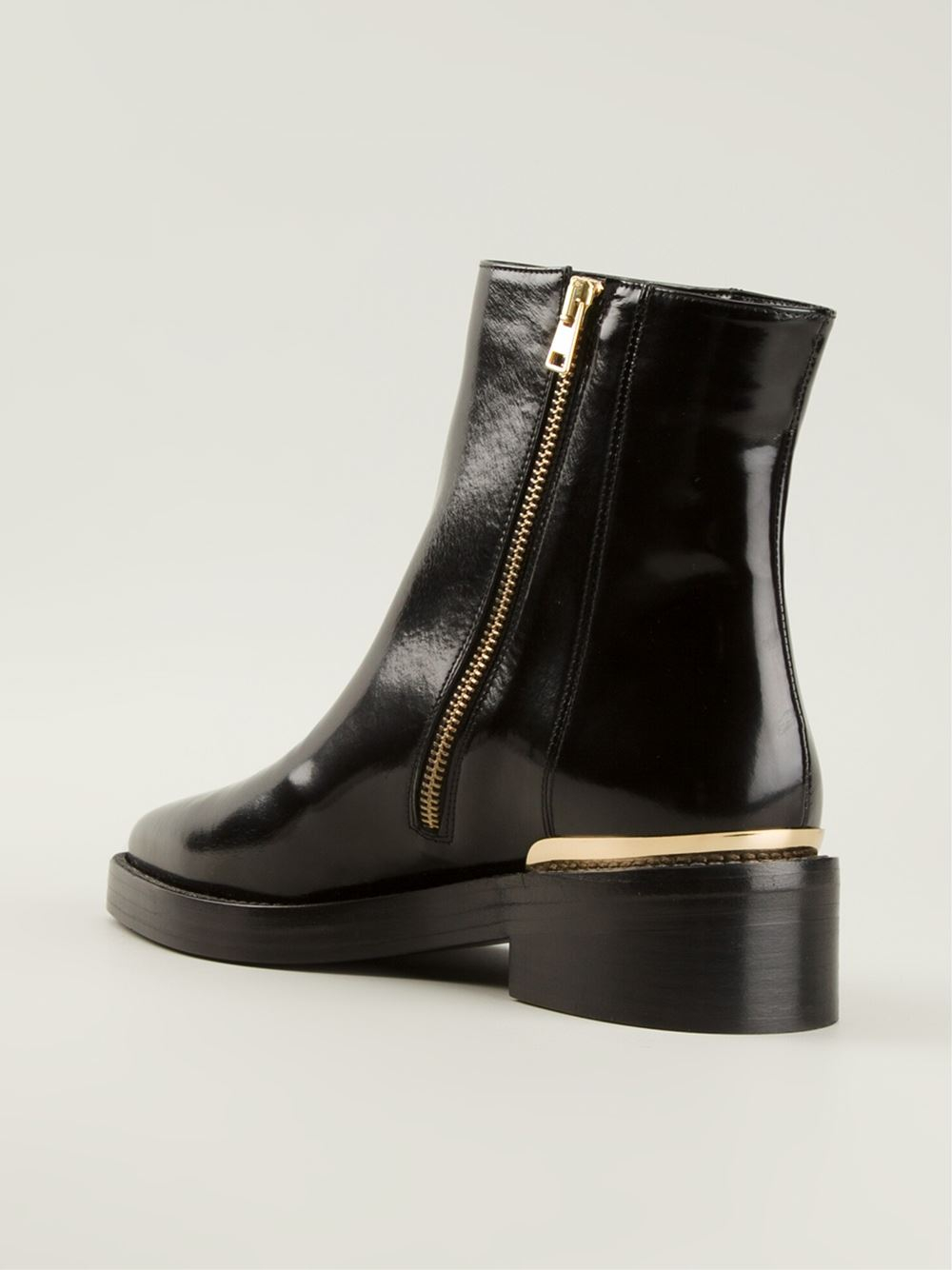 black booties with gold detail