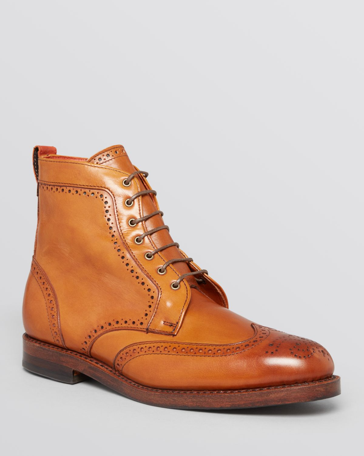 wingtip lace up boots