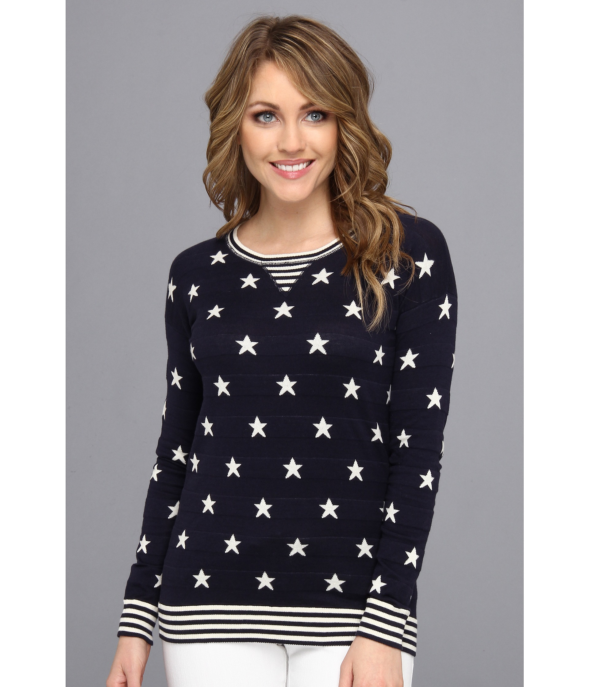 gray sweater with blue stars