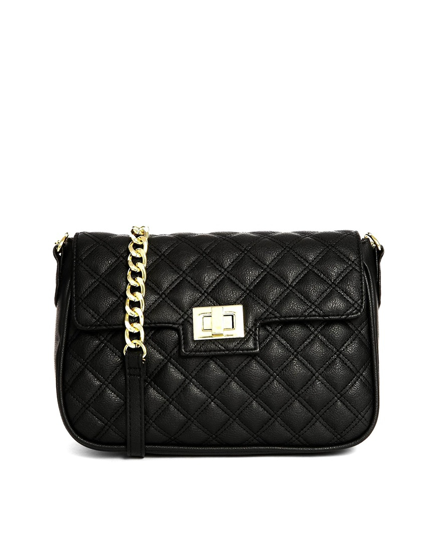 Asos Quilted Cross Bag With Tab And Lock In Black Lyst asos quilted cross bag with tab and lock in black lyst
