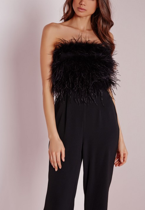 black jumpsuit with feathers