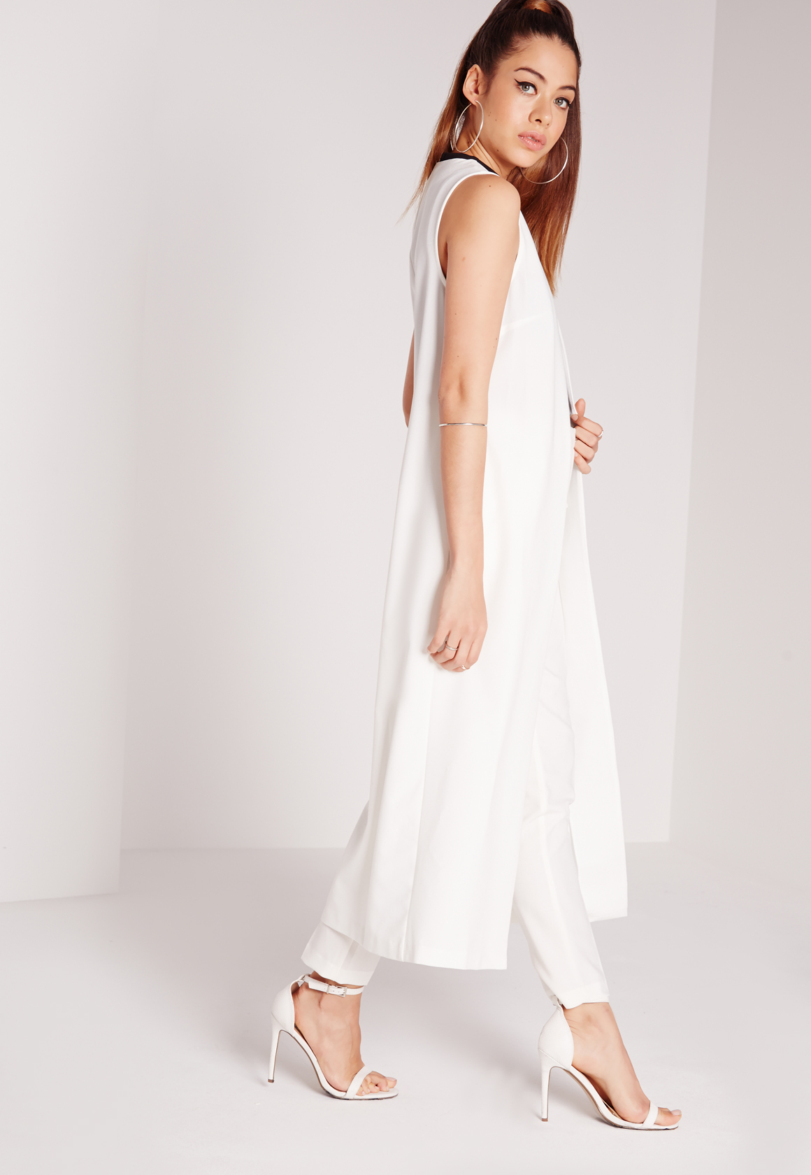 white sleeveless duster jacket