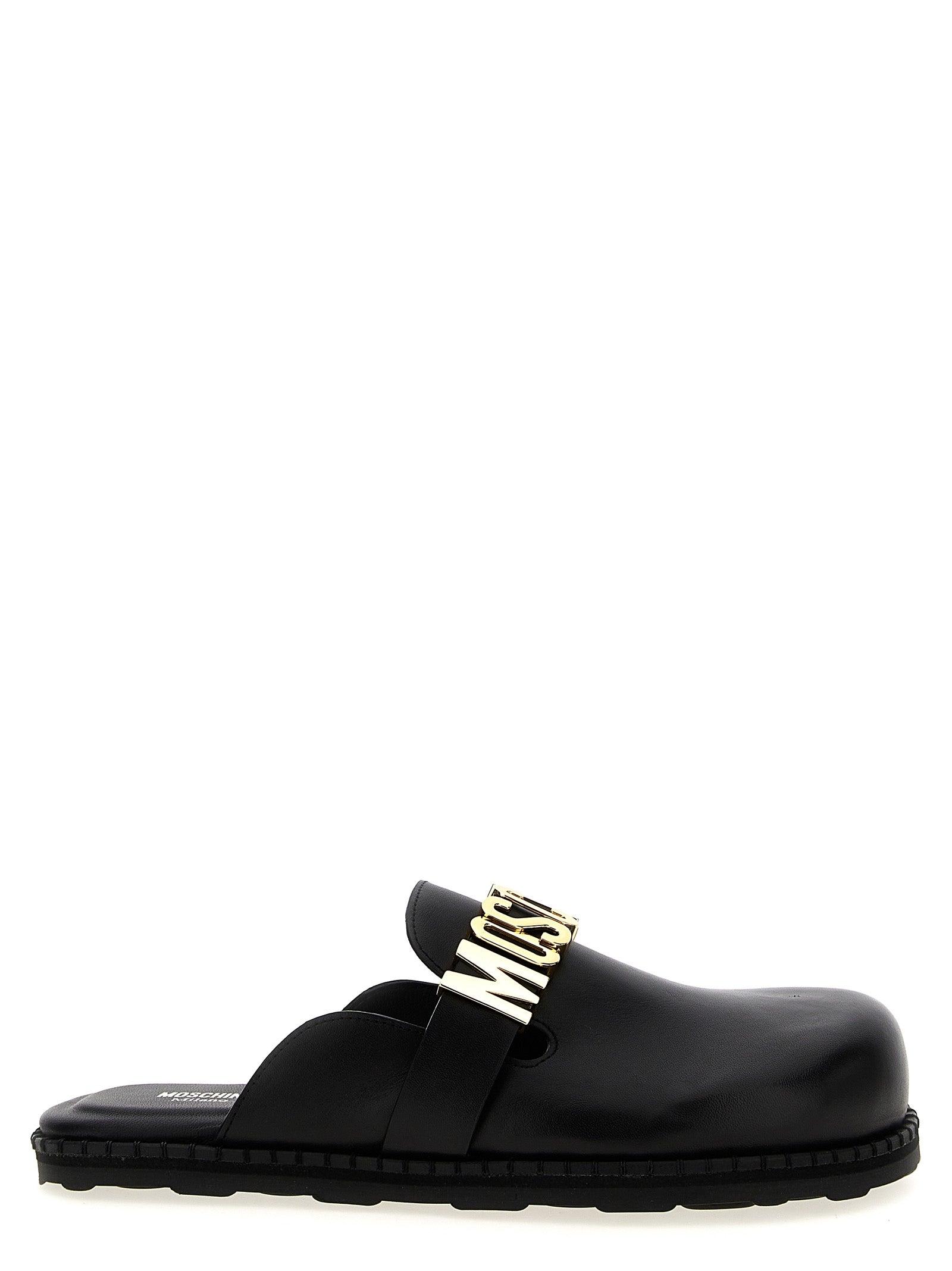 サンダル・ミュール MOSCHINO Women Sandals MA10704C1M MJ0000 BLACK Moschino Flat sandals for Women | Online Sale up to 60% off