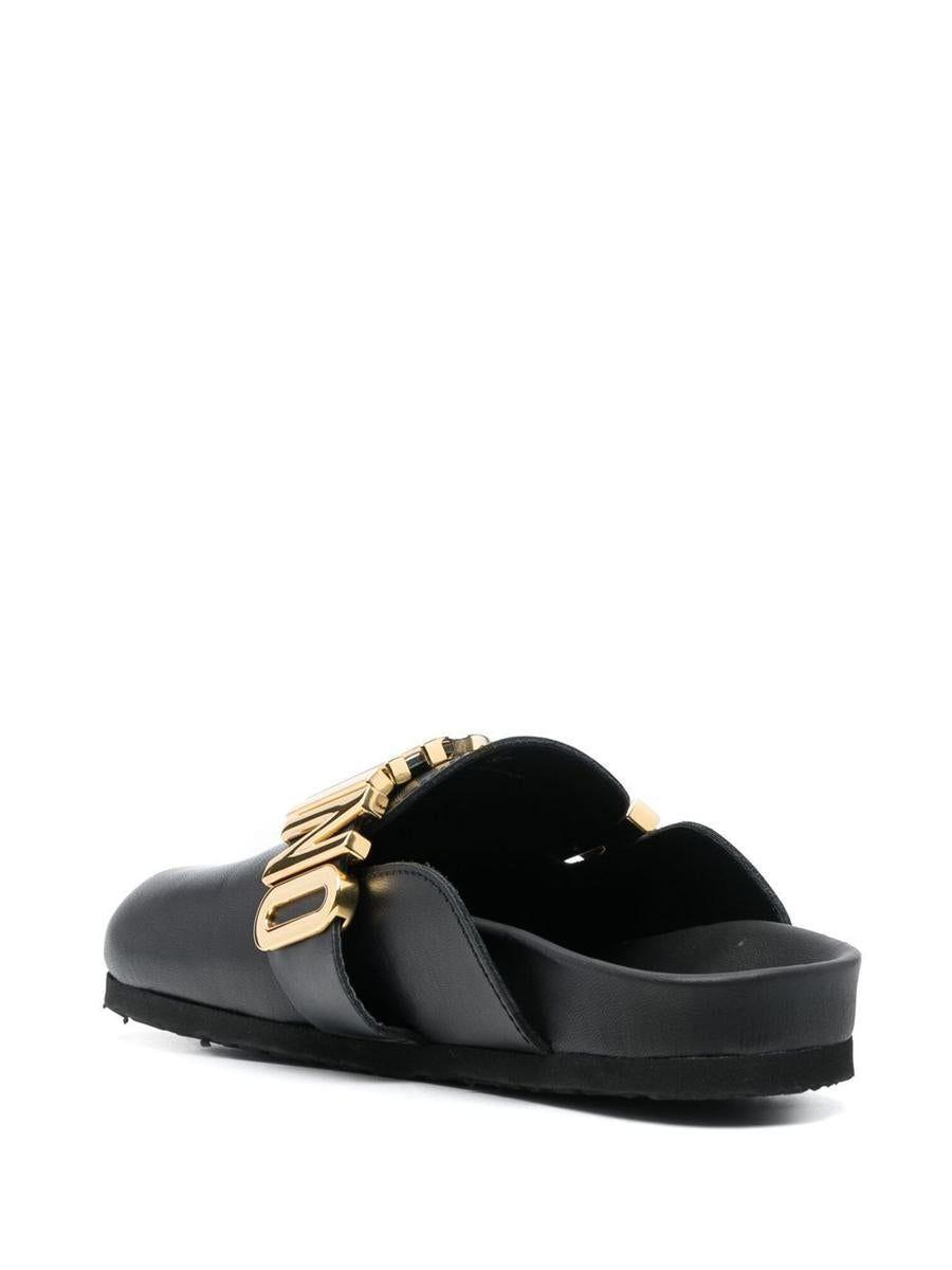 Moschino Leather Mules With Logo Plaque in Black | Lyst