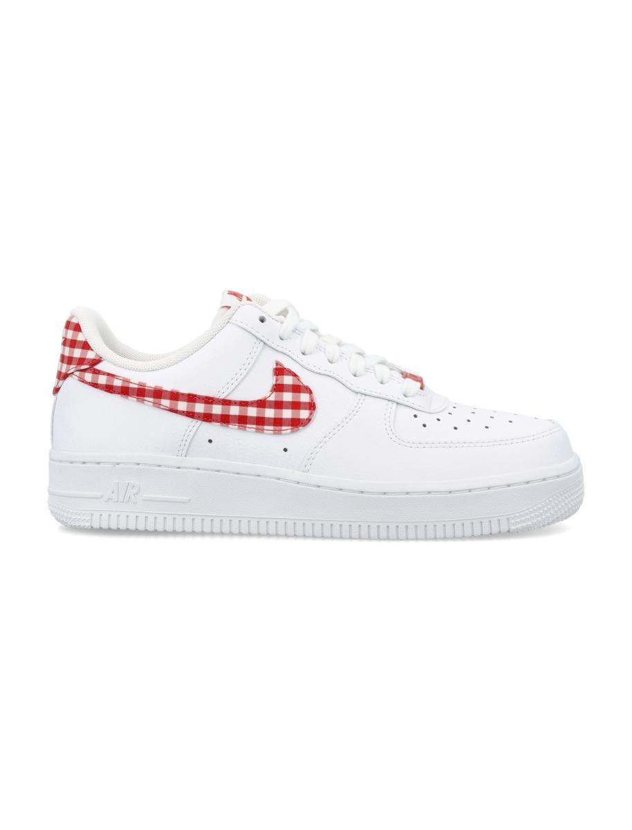 Nike Air Force 1 '07 ESS sneakers in white and orange