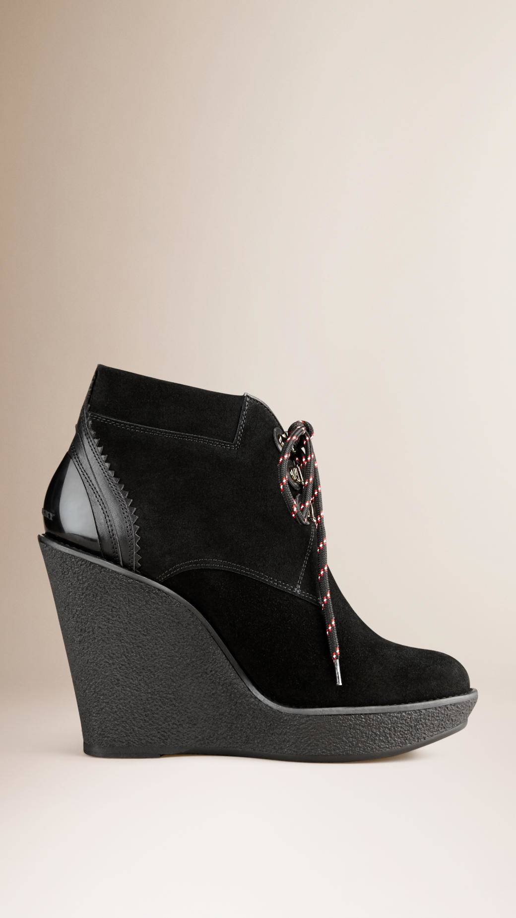 Black suede wedge lace up ankle boots Wedge Ankle Boots. A pair of wedge ankle boots will be among the most versatile styles you have in your closet. Whether you’re heading out with friends, shopping the day away or going on a romantic date, take your pick of suede and leather boots with eye-catching embellishments.