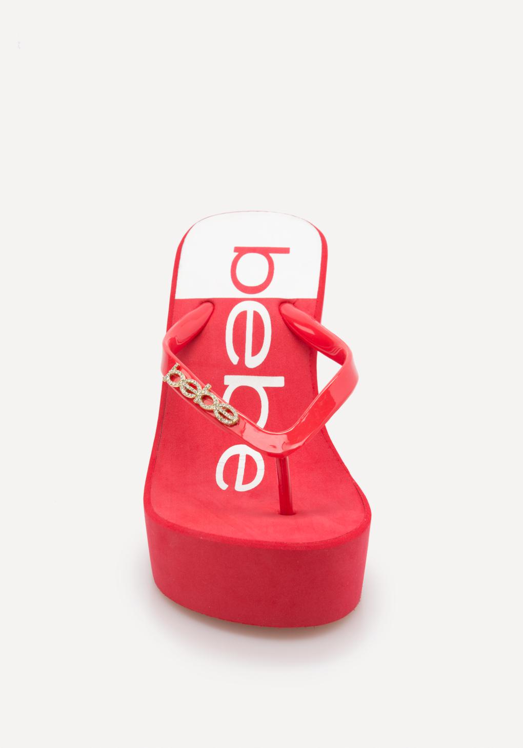 Bebe Synthetic Raaven Wedge Flip Flops in Red/White (Red) - Lyst