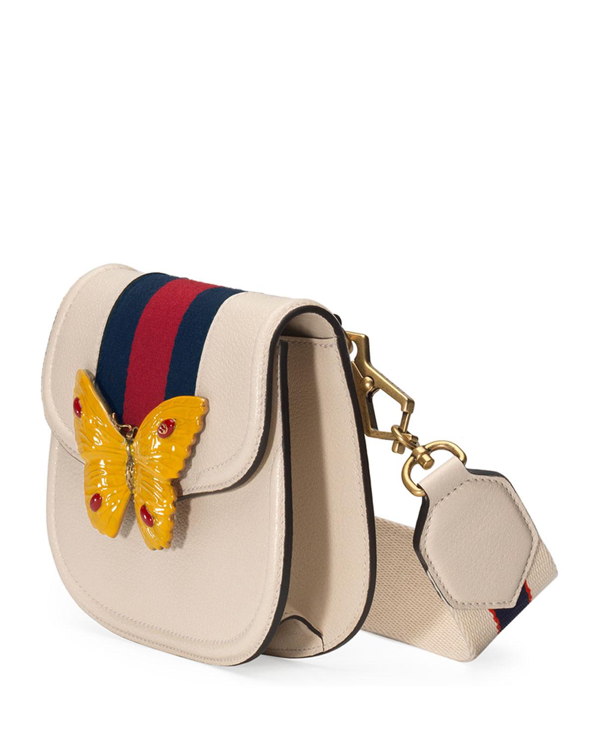 white gucci bag with butterfly