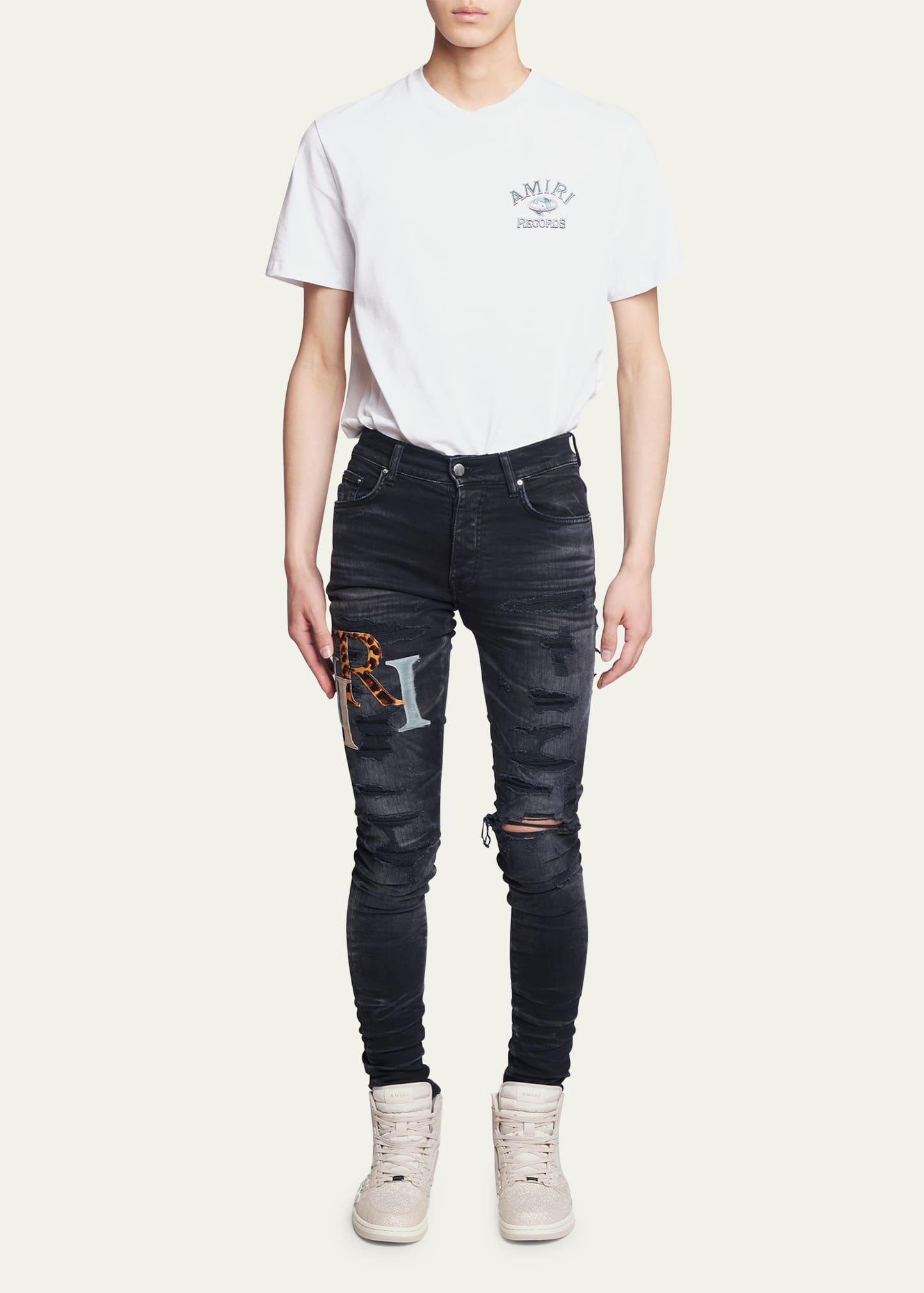 Amiri black art patch painted jeans sales