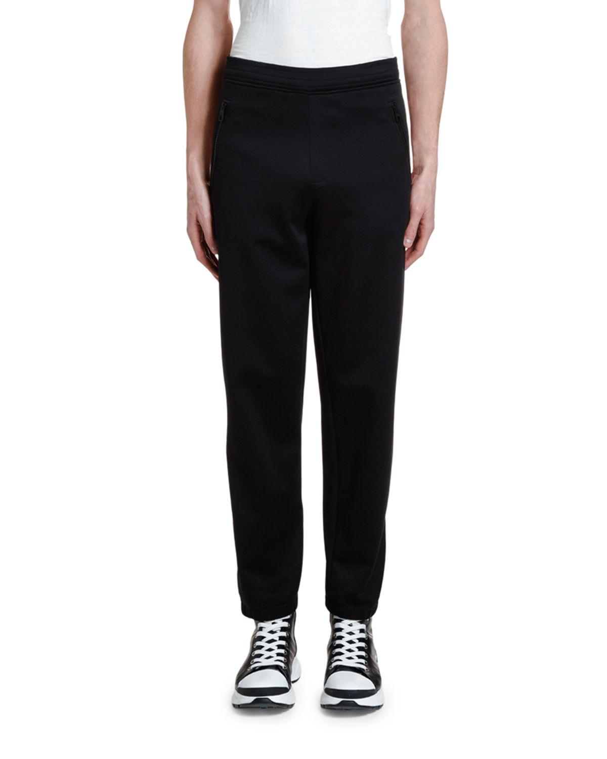 black jogger pants with white stripe