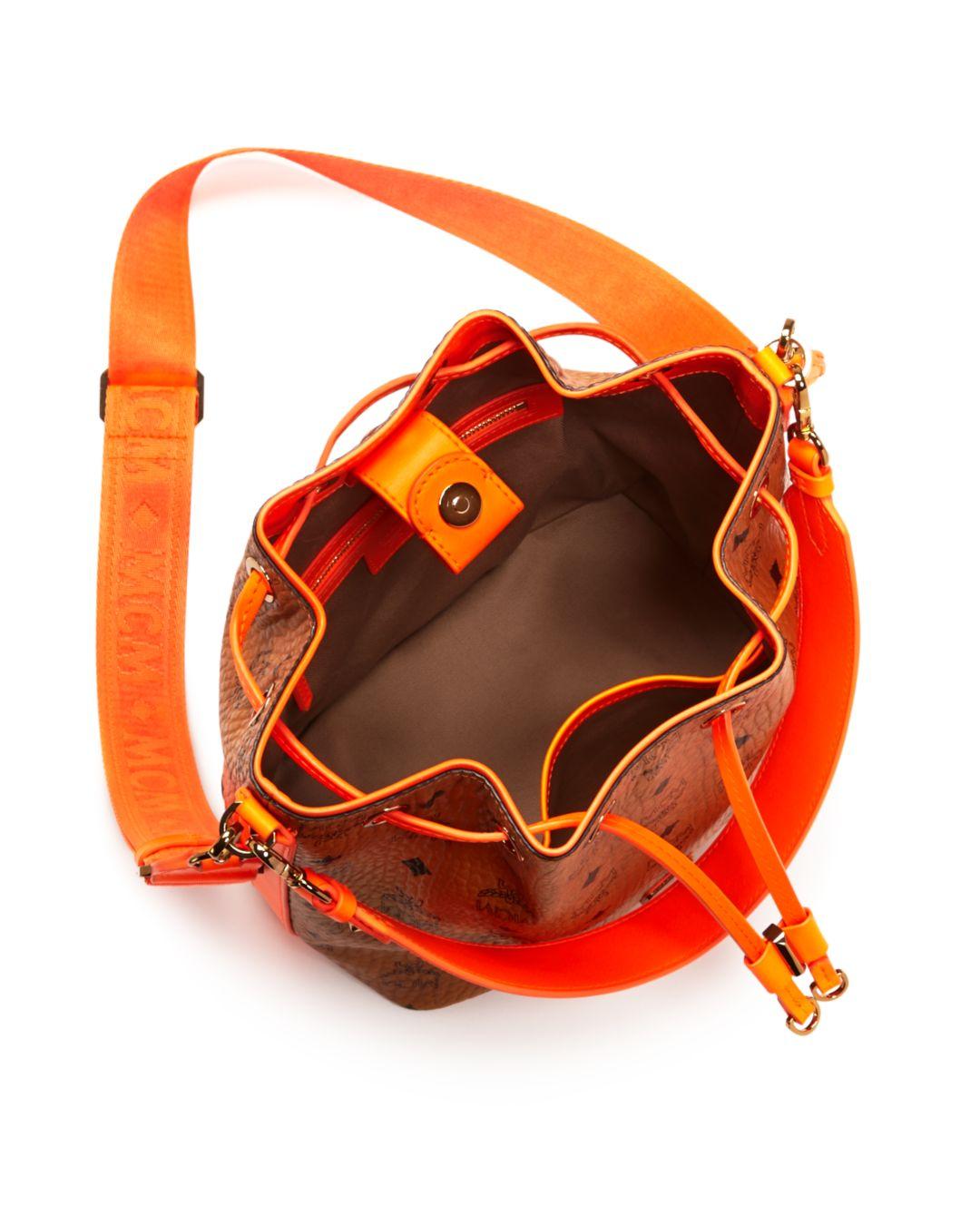 MCM Visetos Crossbody Bucket Bag in Cognac/Orange/Gold (Orange) Lyst