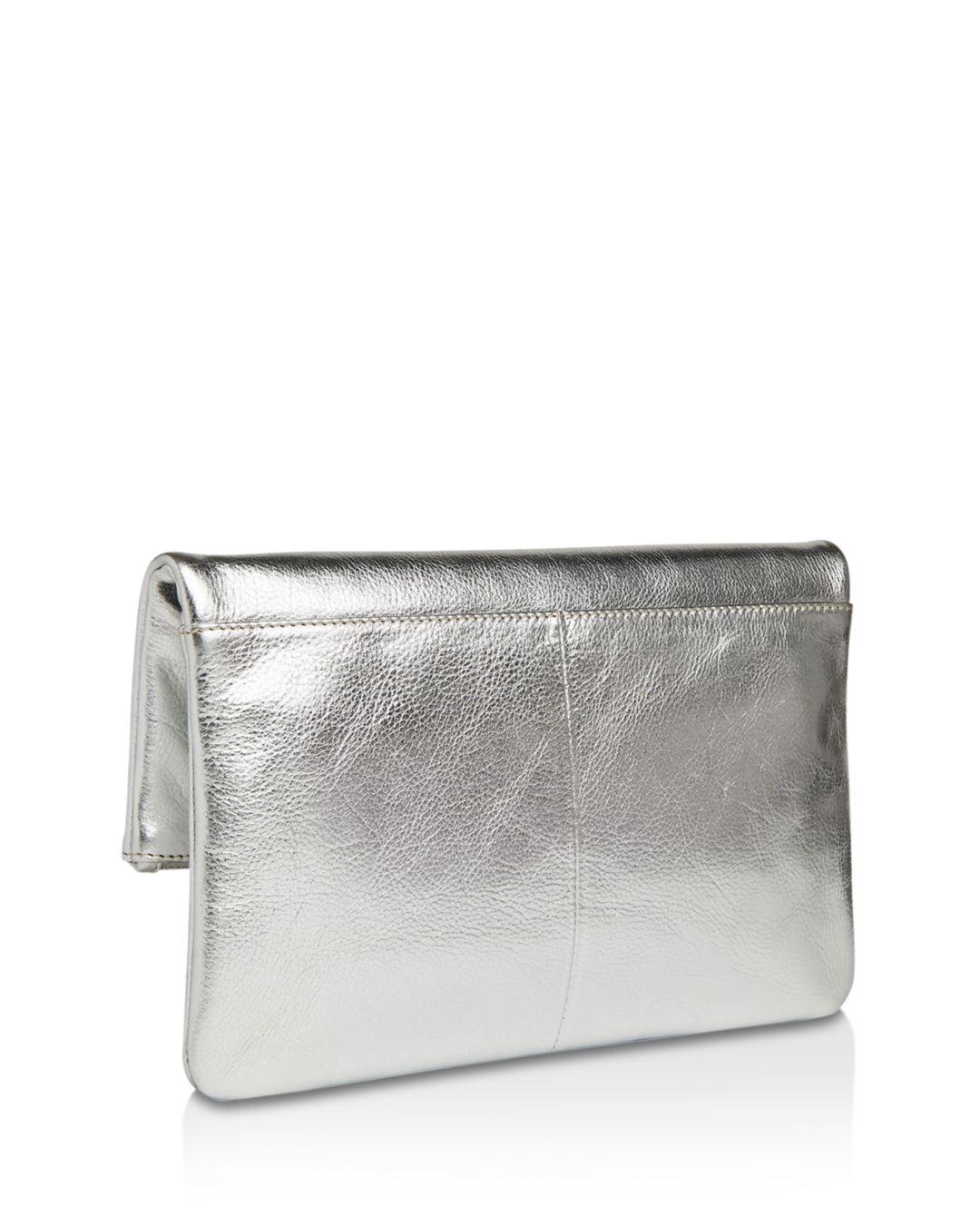 whistles silver clutch