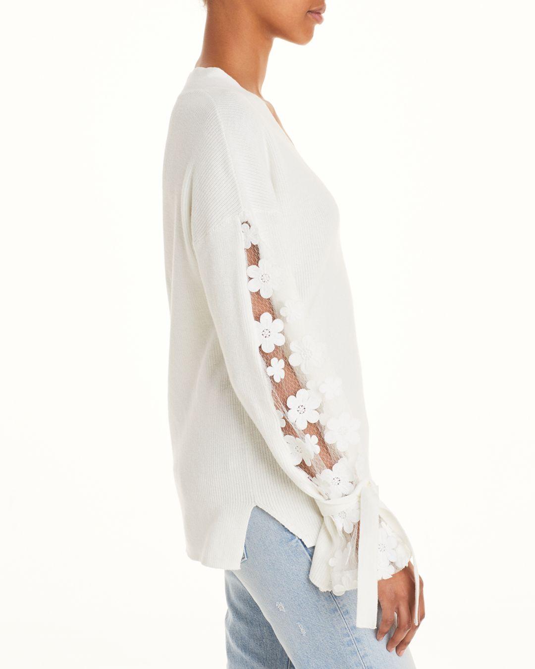 white sweater with lace sleeves