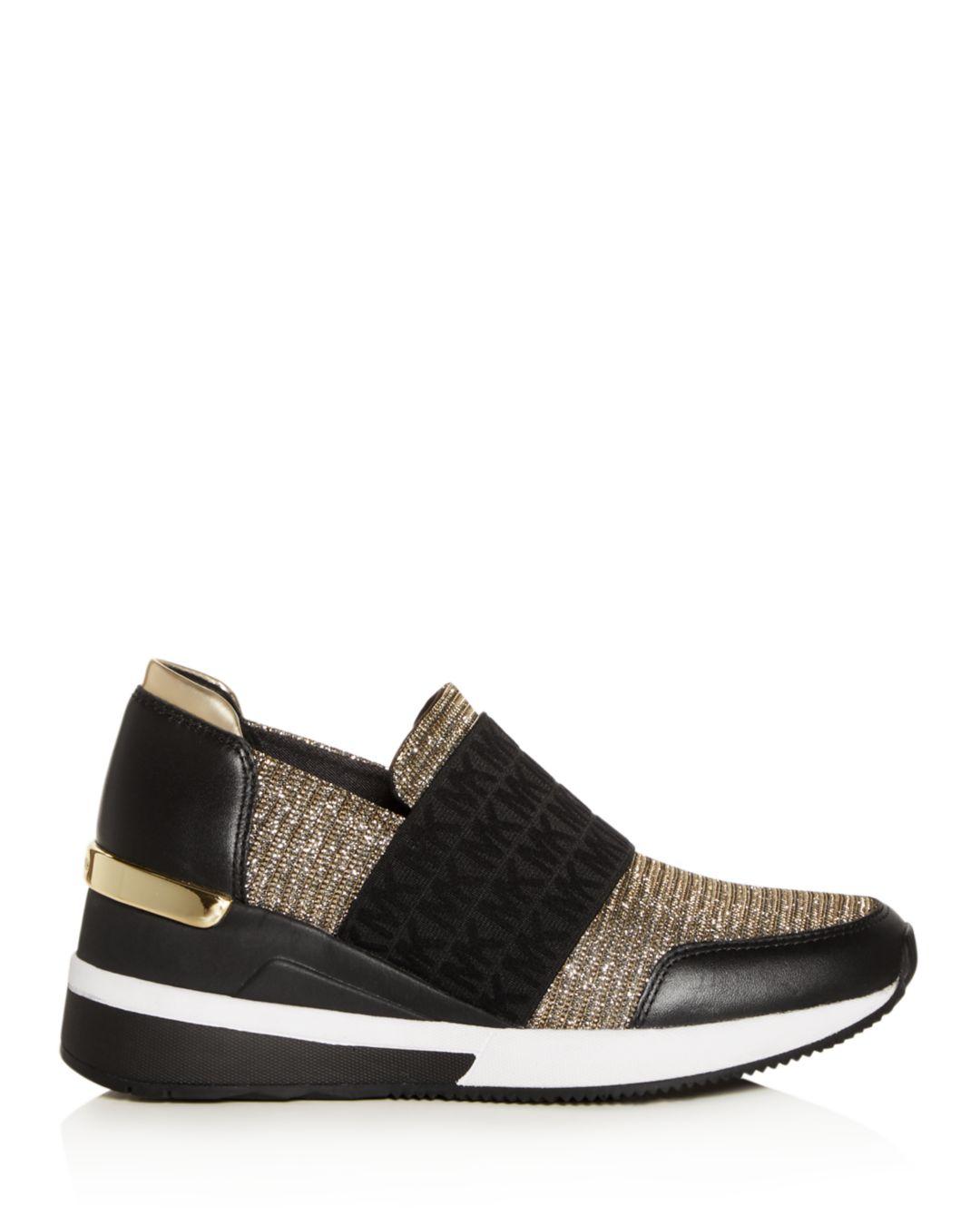 MICHAEL Michael Kors Leather Women's Felix Slip - On Wedge Sneakers in  Black/Gold (Black) | Lyst
