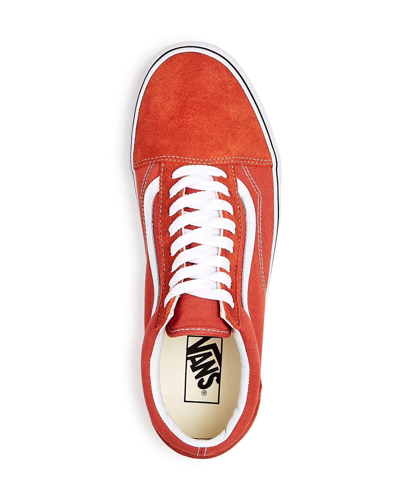 orange vans with black laces