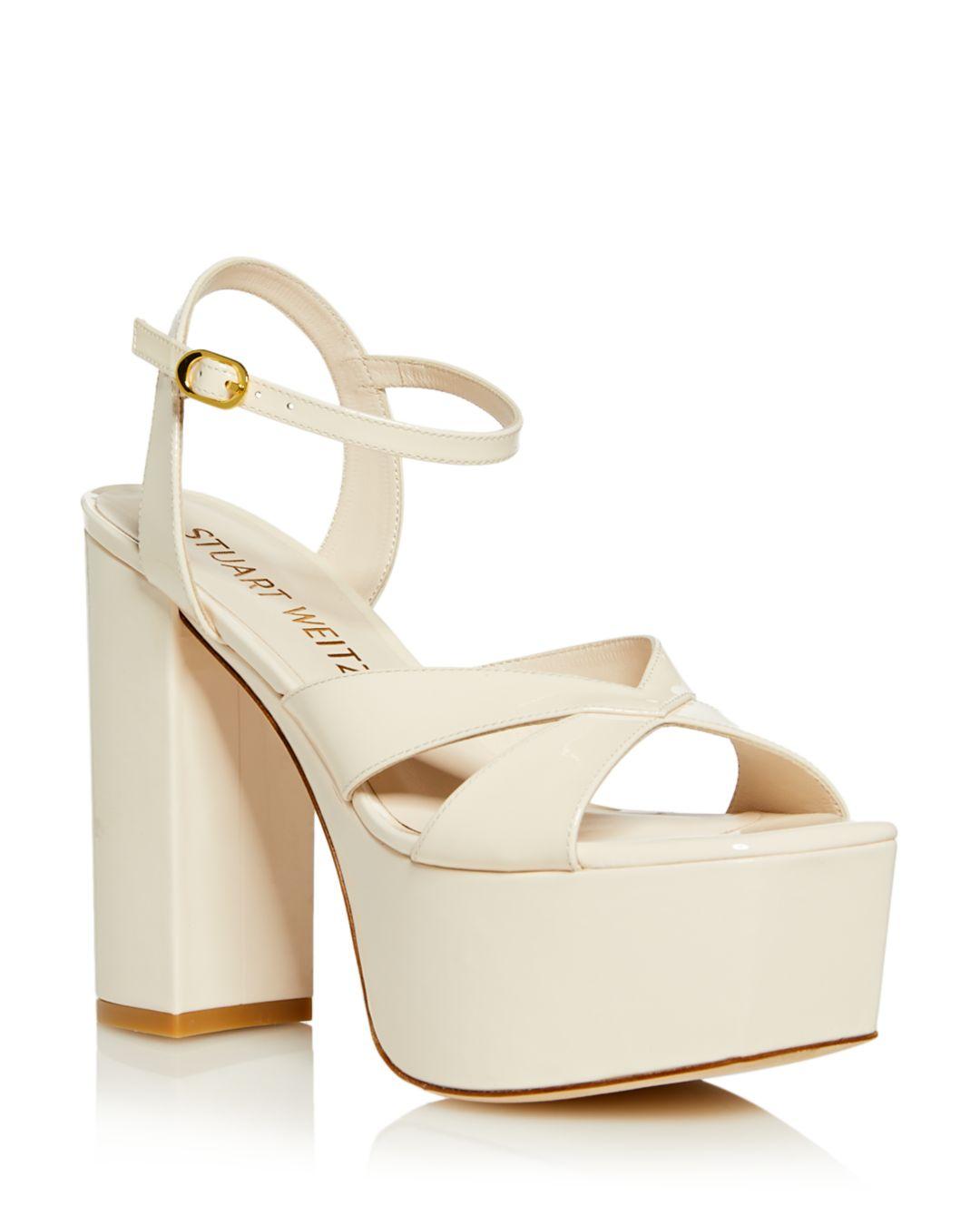 https://www.lyst.com/shoes/stuart-weitzman-miami-square-toe-high-heel-platform-sandals-1/
