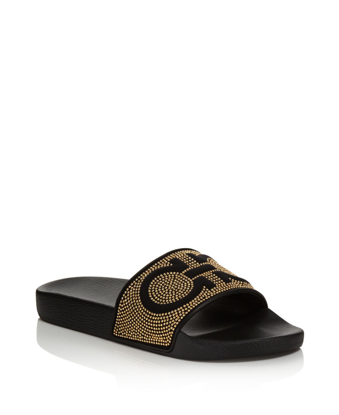 black and gold ferragamo slides