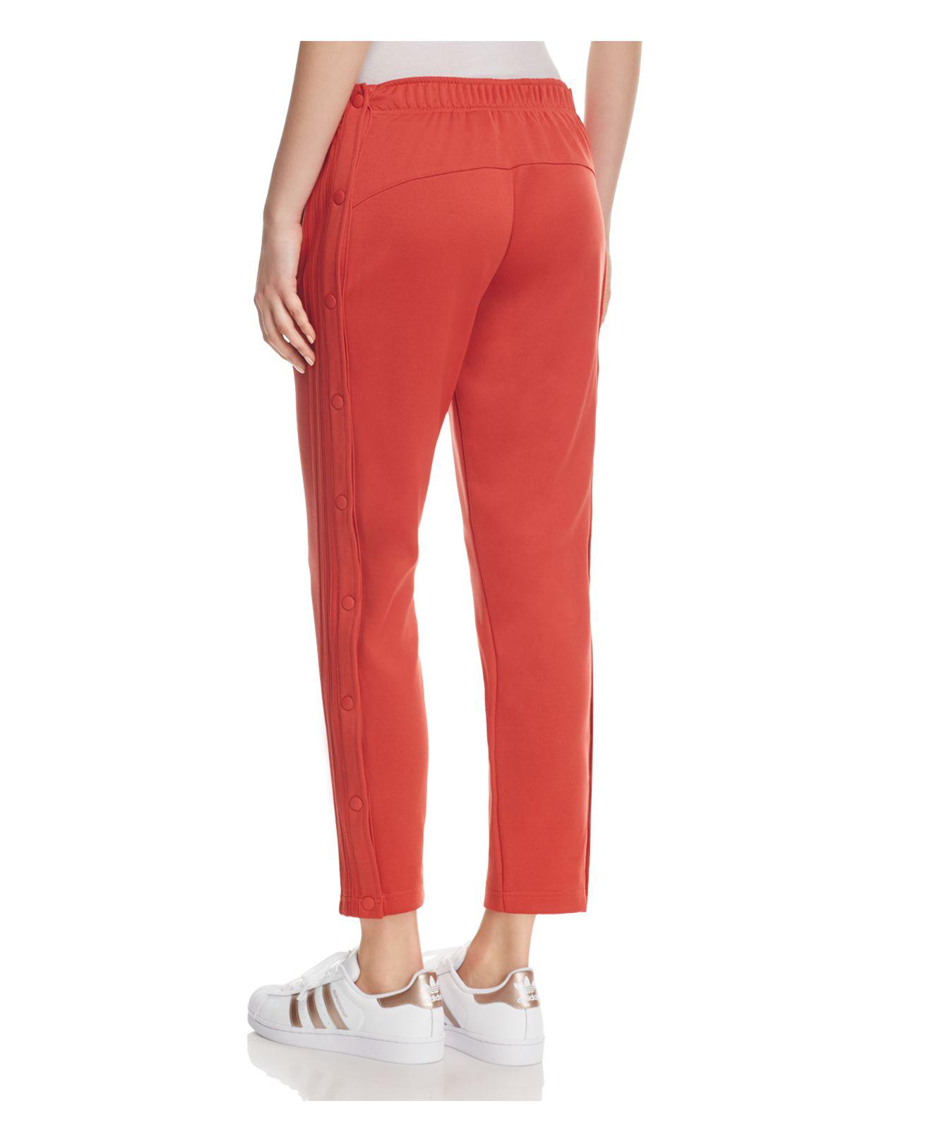 adidas originals adicolor three stripe track pants in red