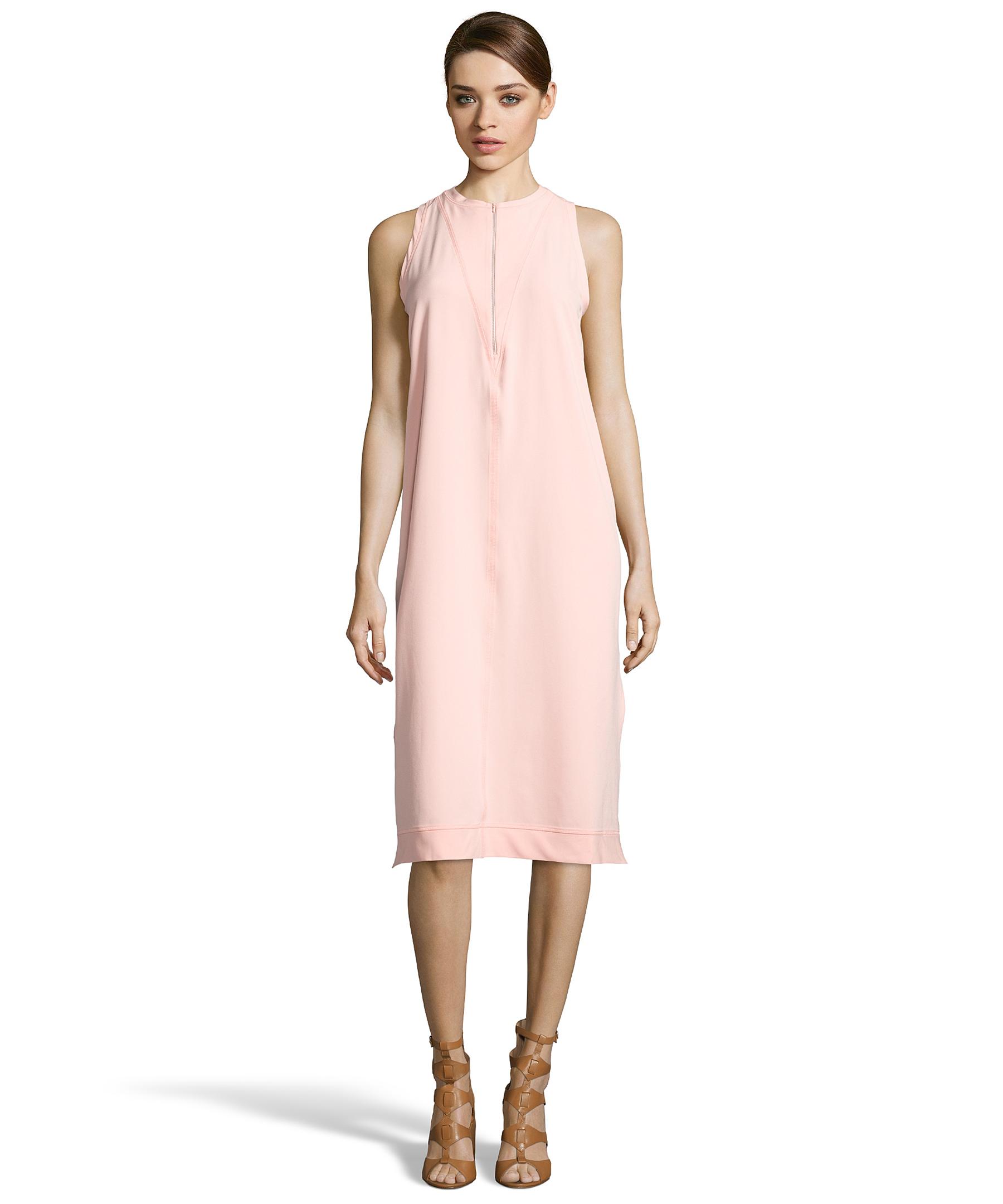 Pink Shift Dress Flaunt a short pink lace shift dress that blends romance and comfort. This soft short party dress features a stylish relaxed design and a spandex-lace fabric for a cute look at any special celebration.