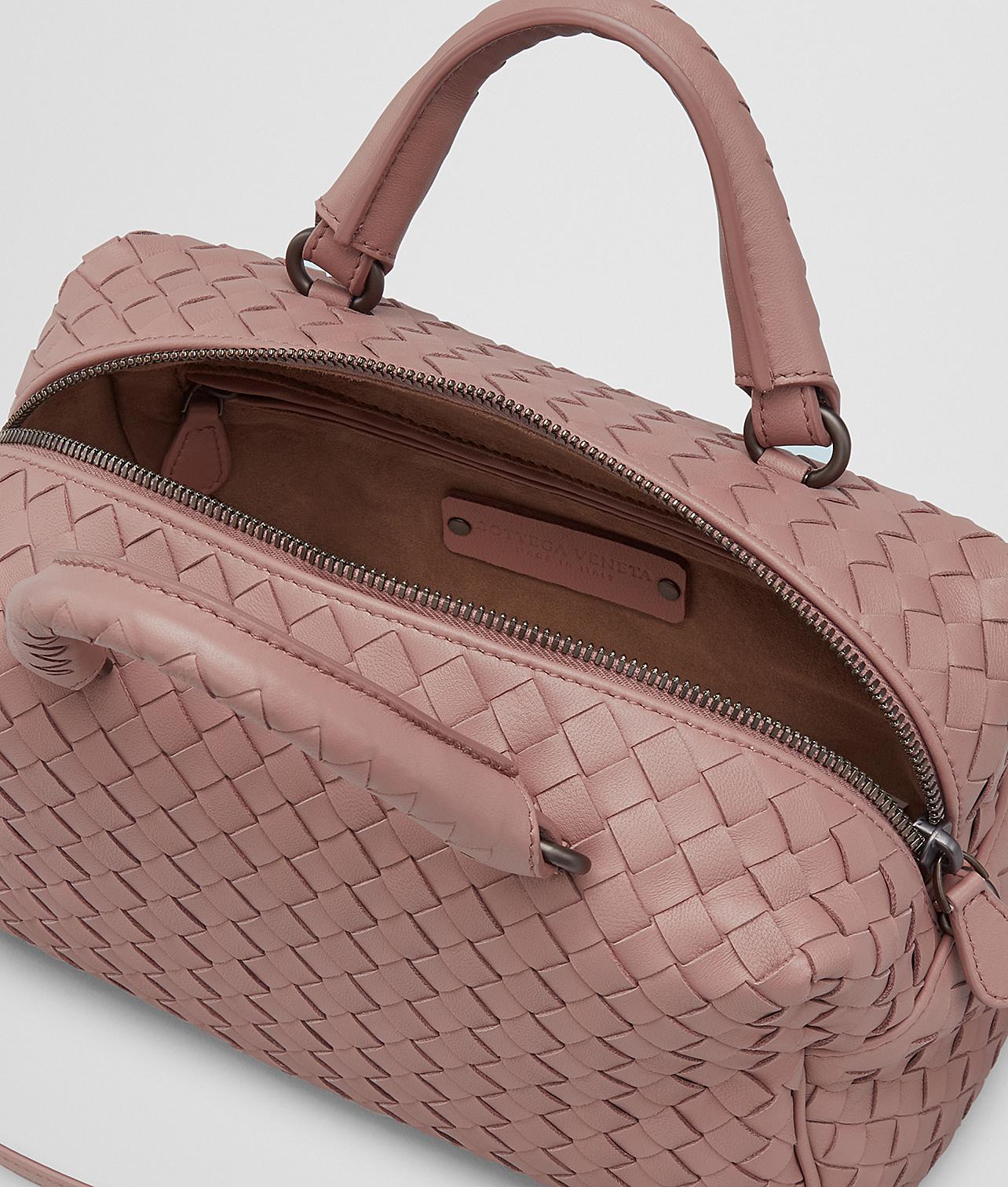 white luggage with brown trim