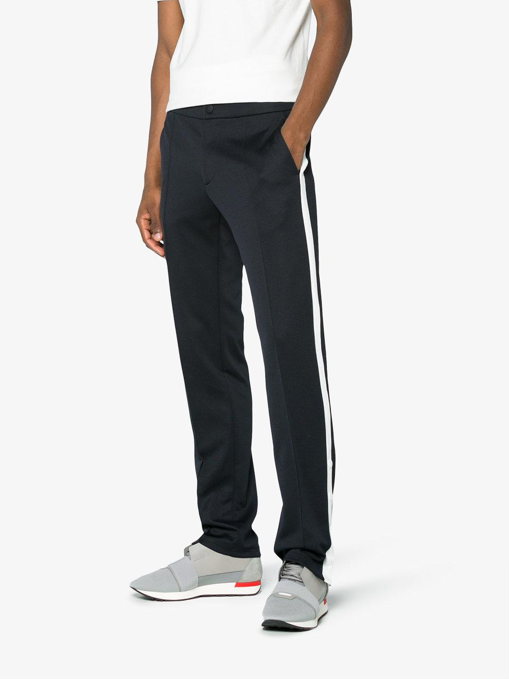 blue track pants with white stripe