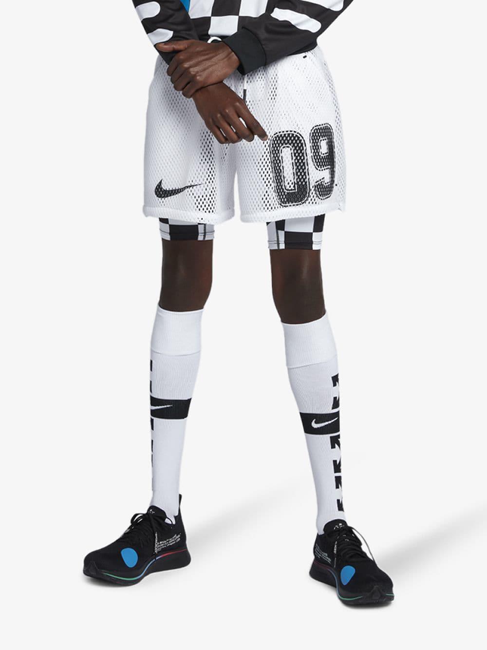 white nike football shorts