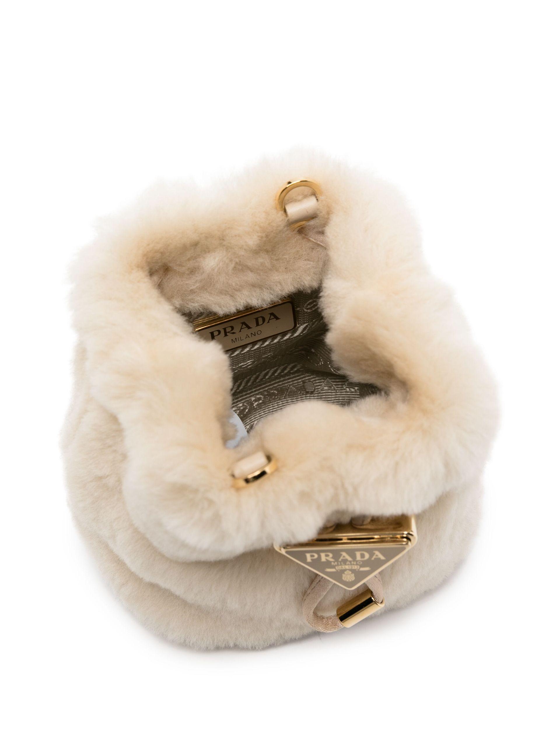 Prada Triangle-Logo Shearling Mini Bag in White | Lyst