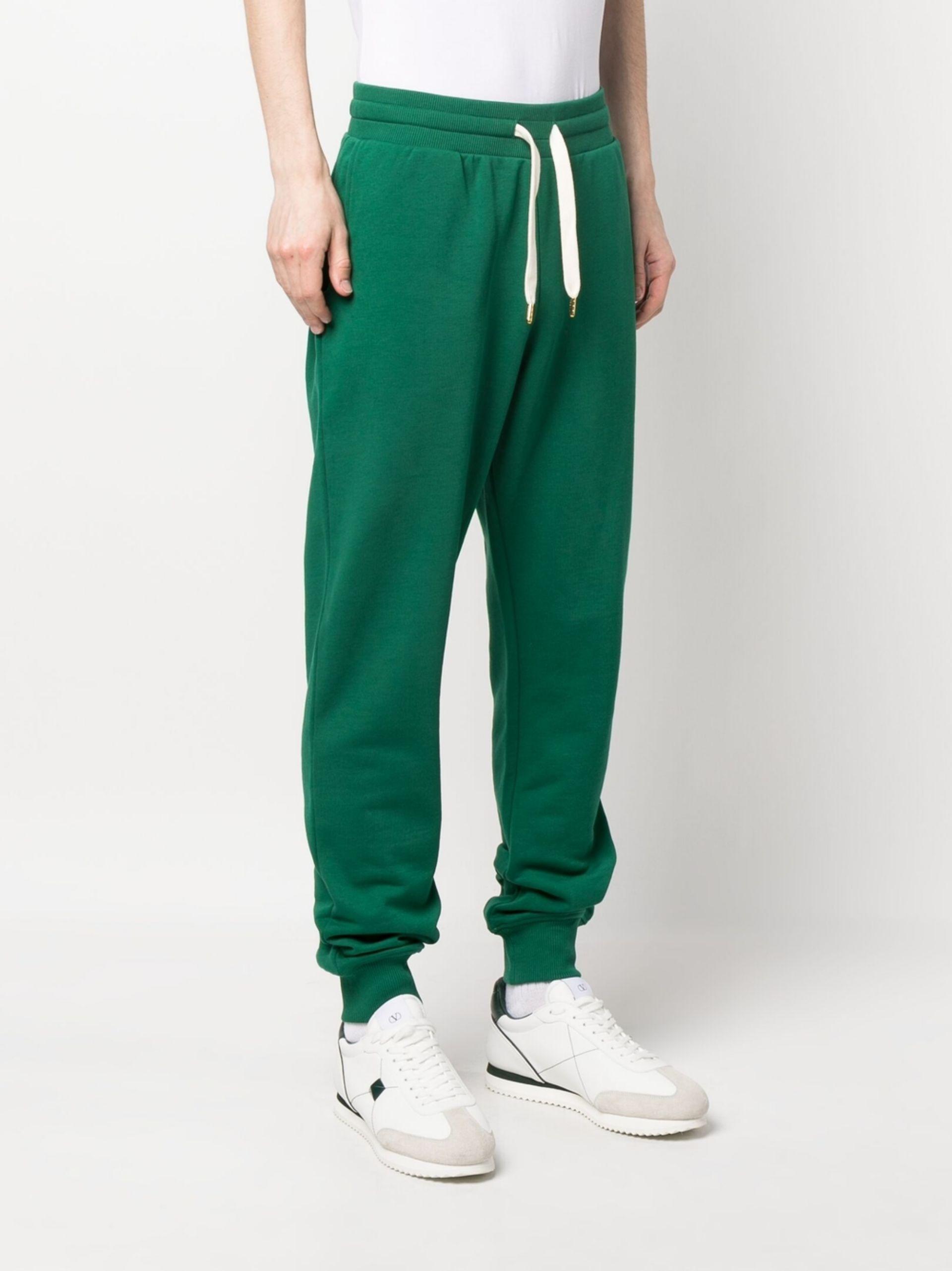 Red and green track pants sales