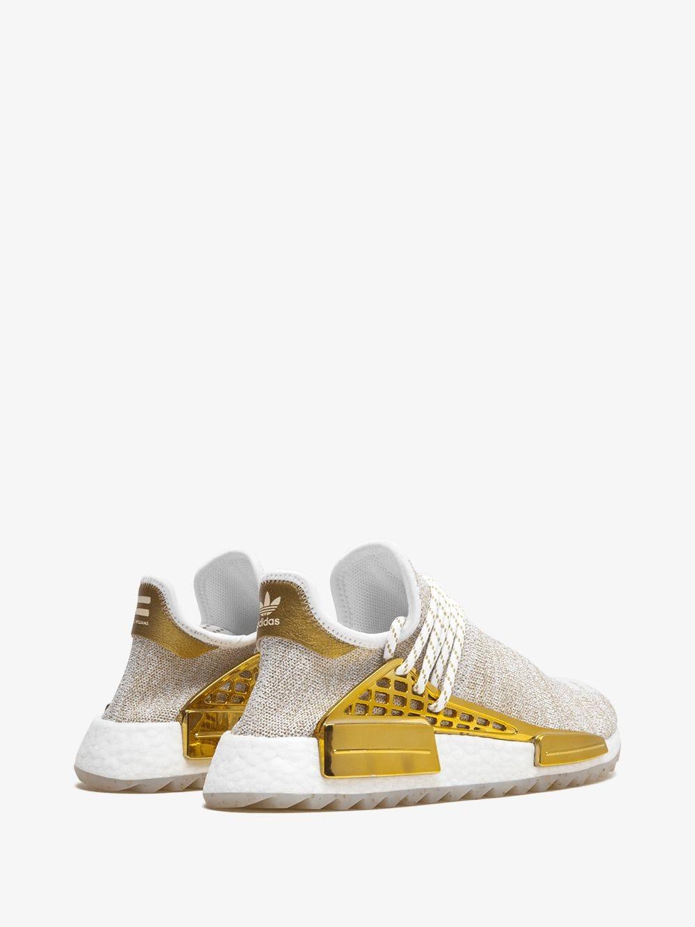 pharrell williams gold shoes