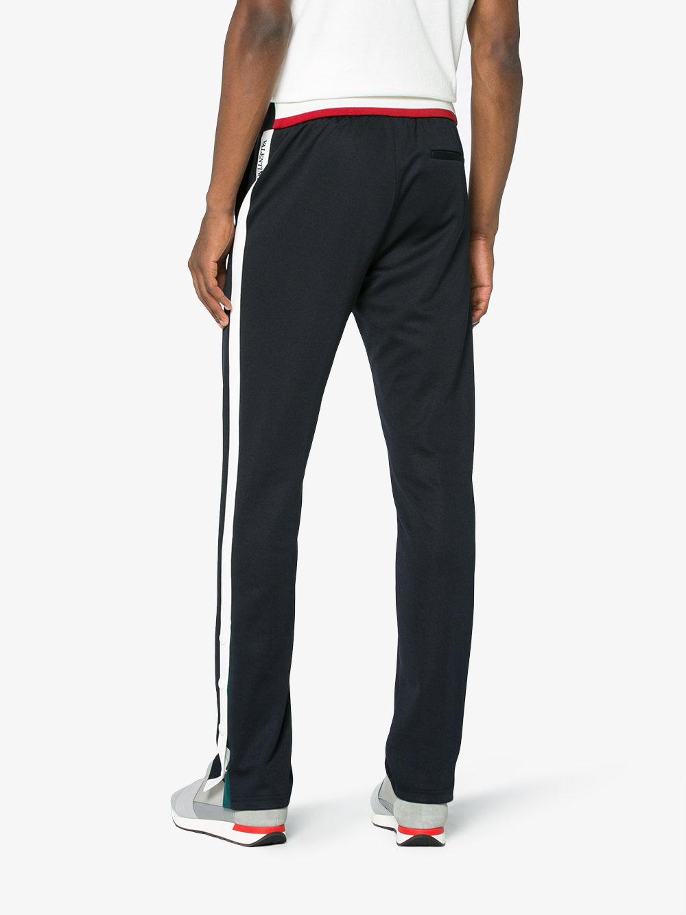 blue track pants with white stripe
