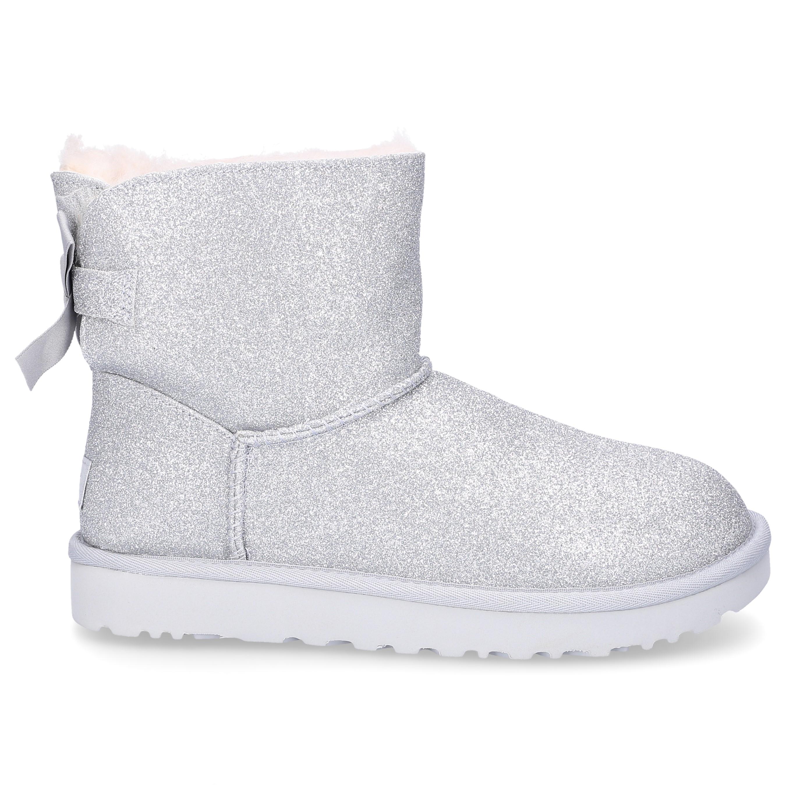 UGG Mini Bailey Bow Glitter And Silver Sheepskin Ankle Boots Women's Snow  Boots In Silver in Metallic - Lyst
