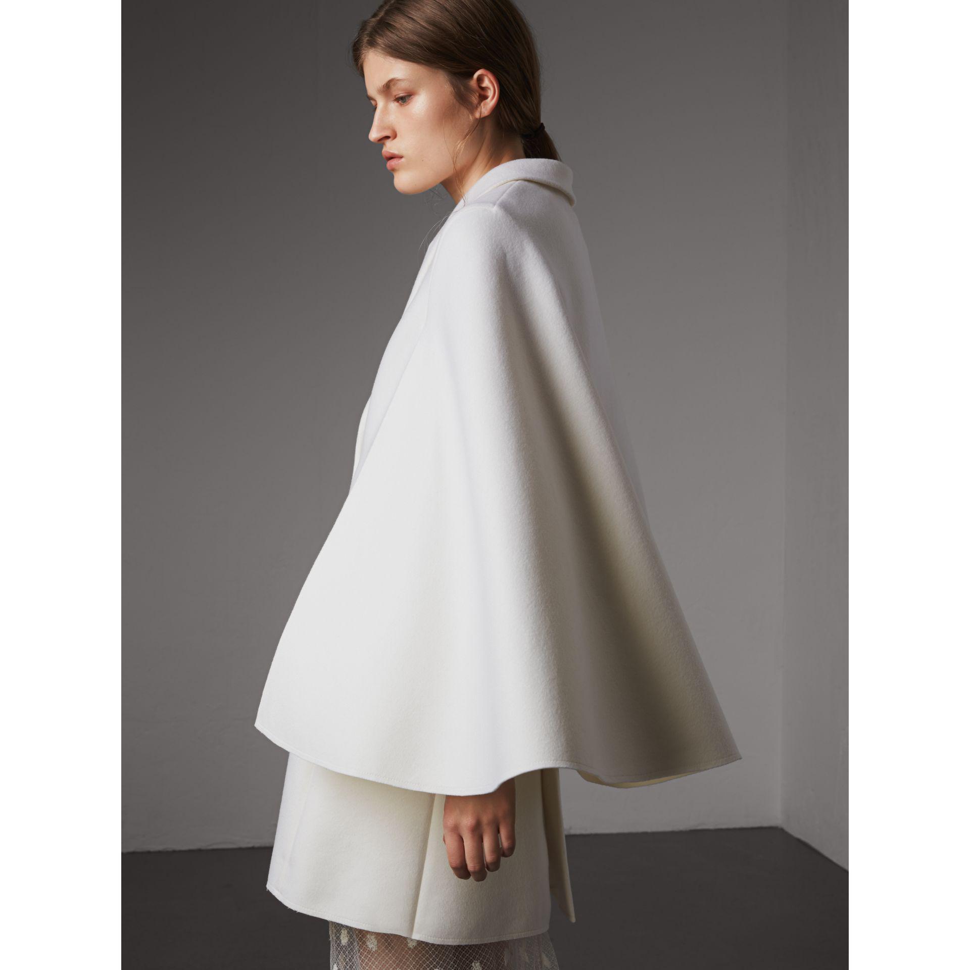 white cape coat