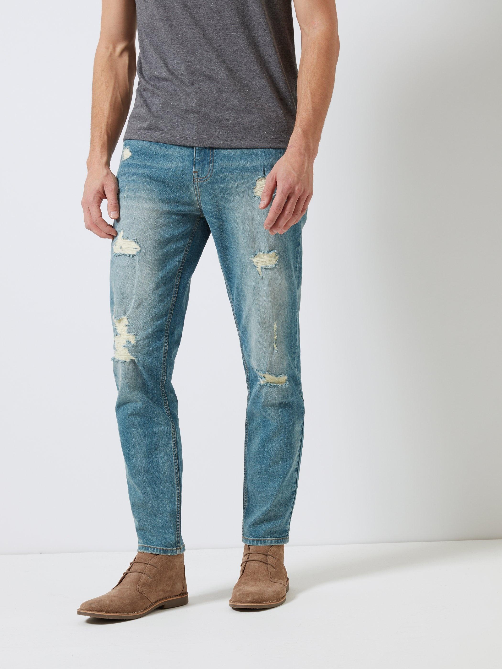 ripped carrot fit jeans