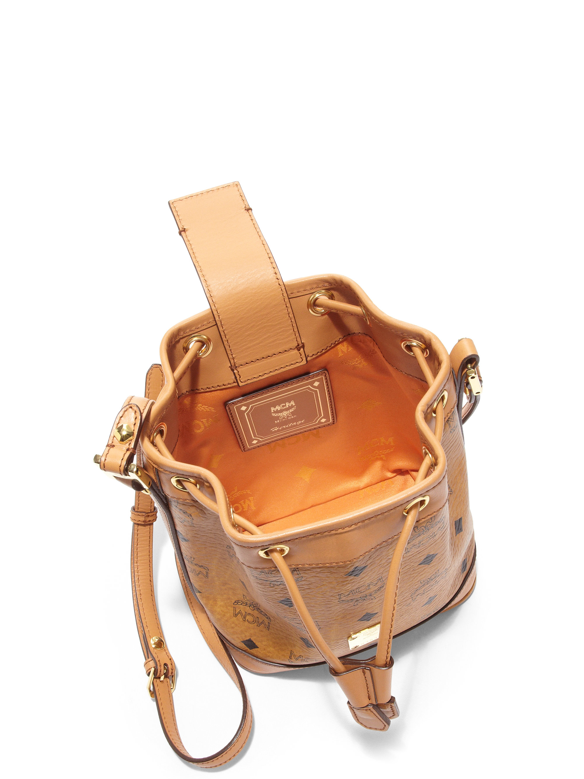 Lyst Mcm Heritage Mini Coated Canvas Drawstring Bucket Bag In Brown Gallery