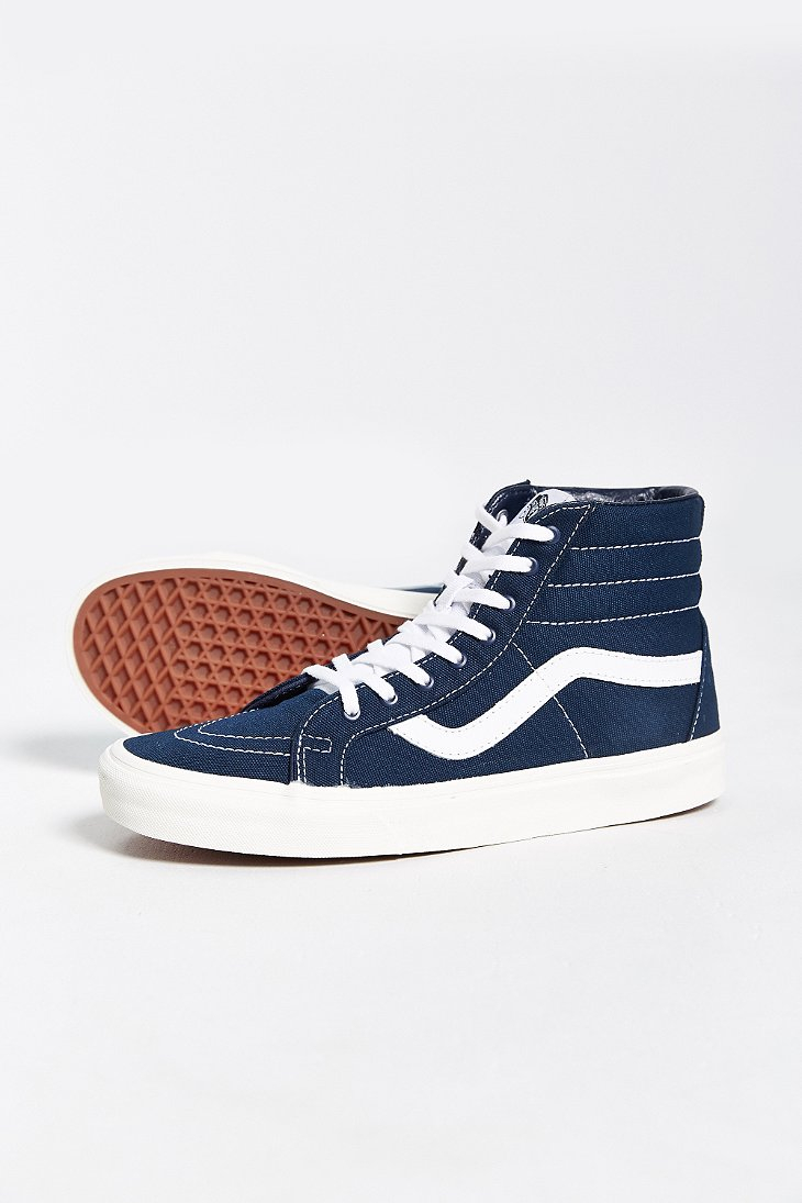navy blue and white high top vans