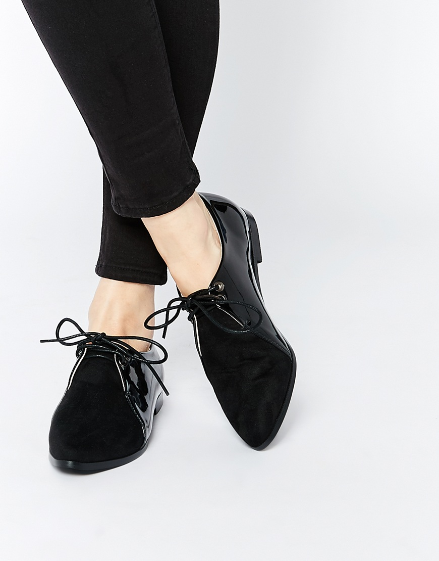 black pointed lace up flats