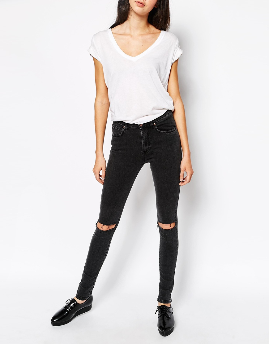black ripped knee skinny jeans