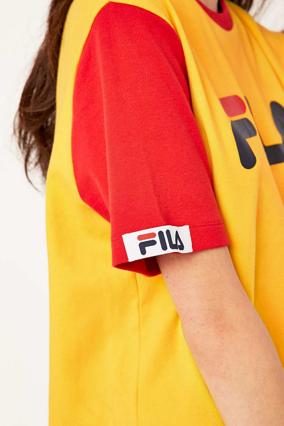 yellow and red fila shirt