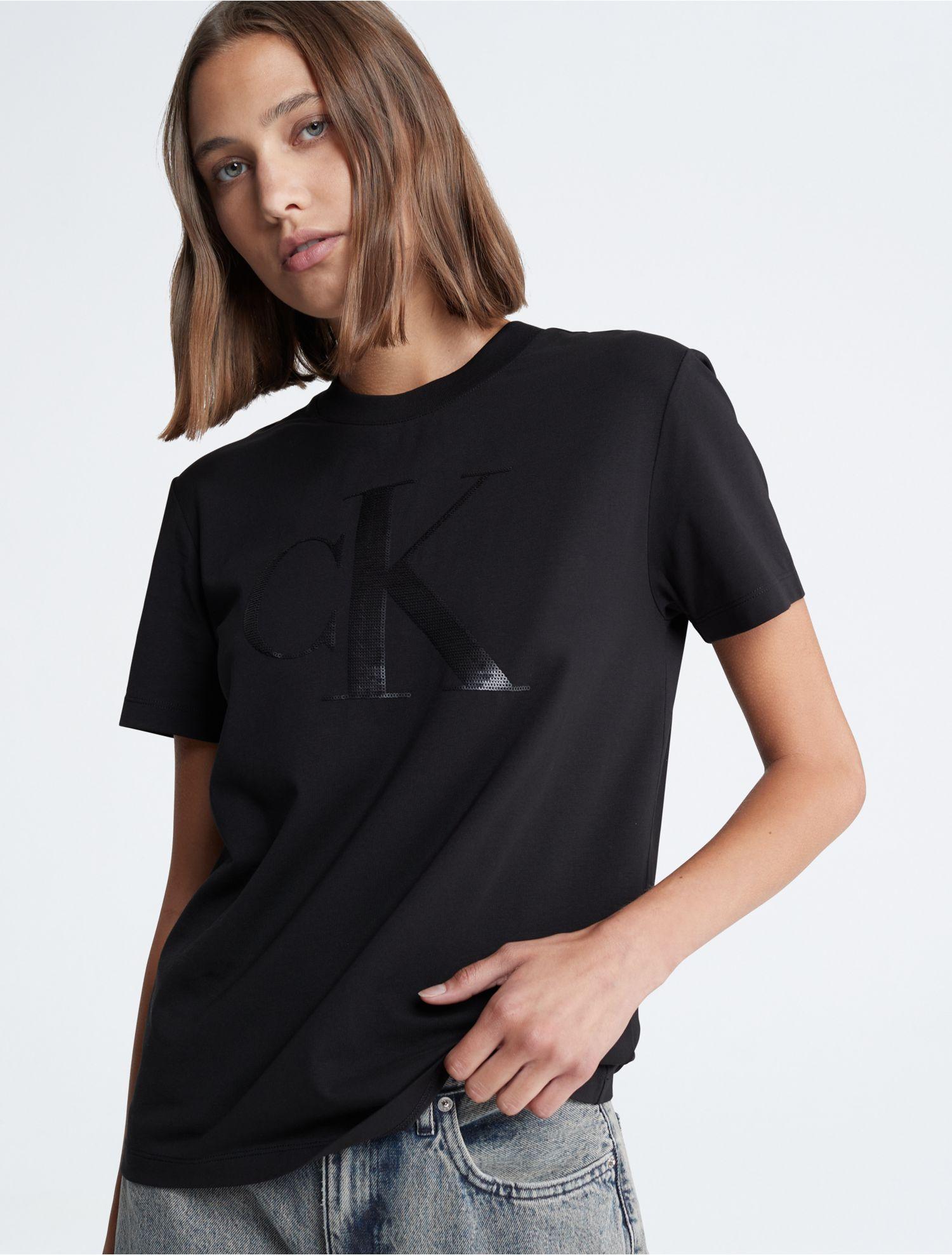 https://cdna.lystit.com/photos/calvinklein/387d7274/calvin-klein-Black-Beauty-Sequin-Monogram-Logo-Crewneck-T-shirt.jpeg