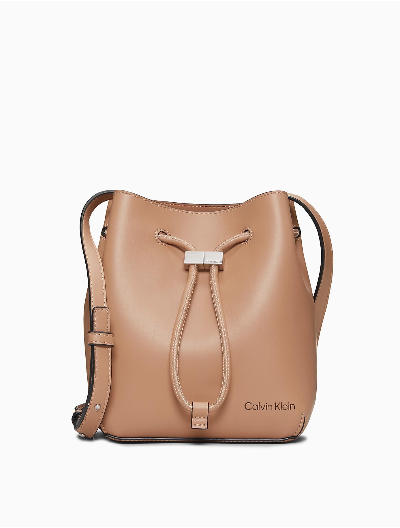 Calvin Klein Smooth Faux Leather Bucket Bag in Brown | Lyst