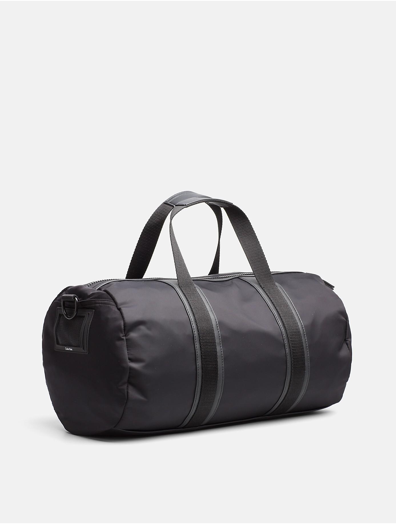 Calvin Klein Nylon Cylinder Weekender Duffle Bag in Black for Men | Lyst