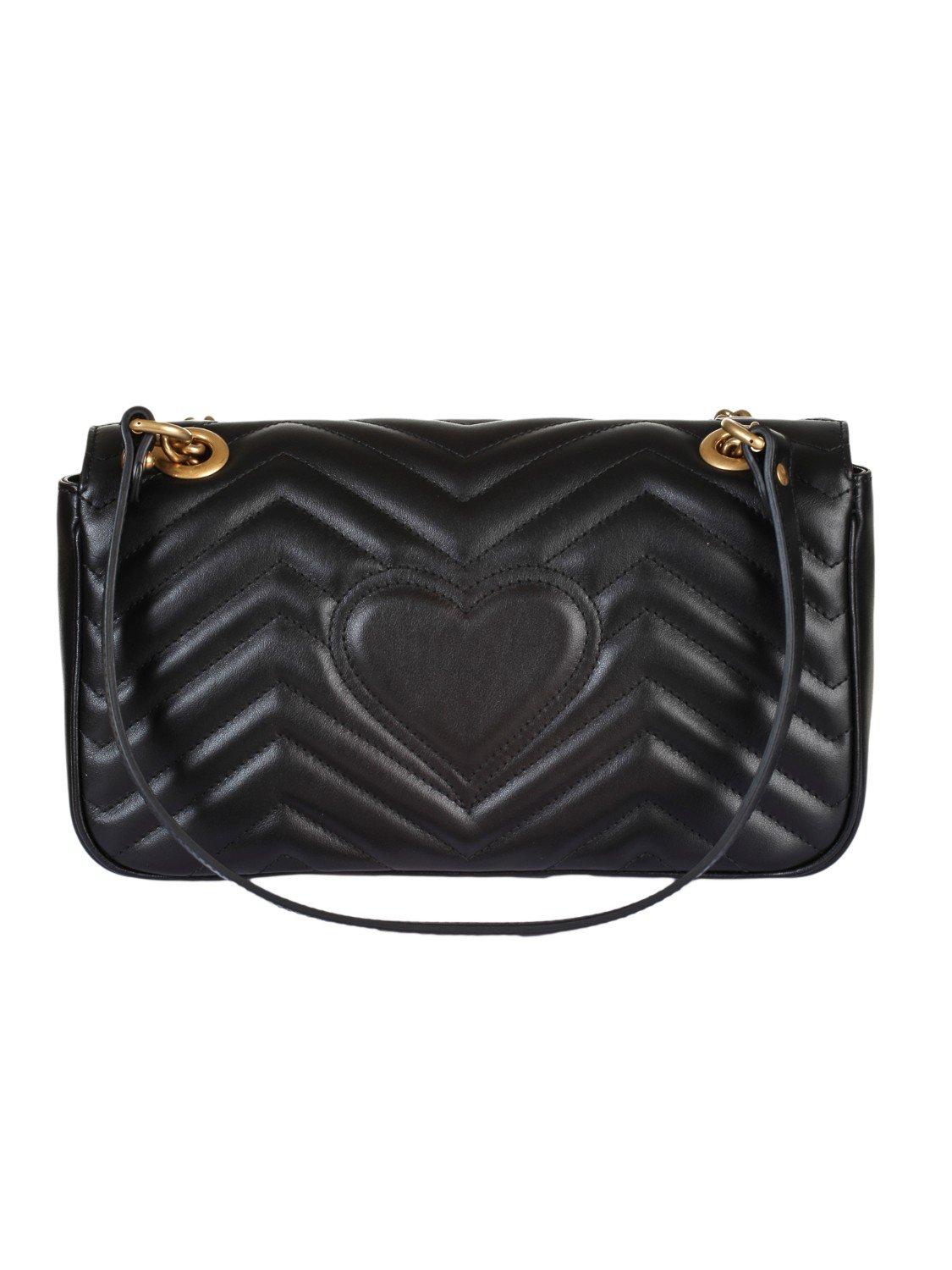 black gucci purse with heart