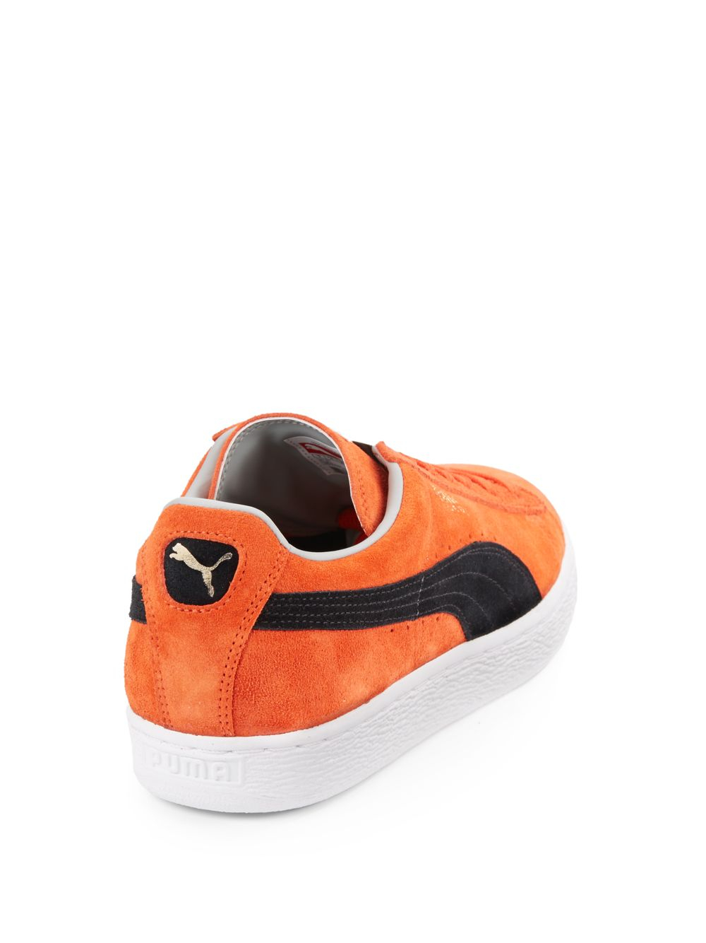 orange puma suede
