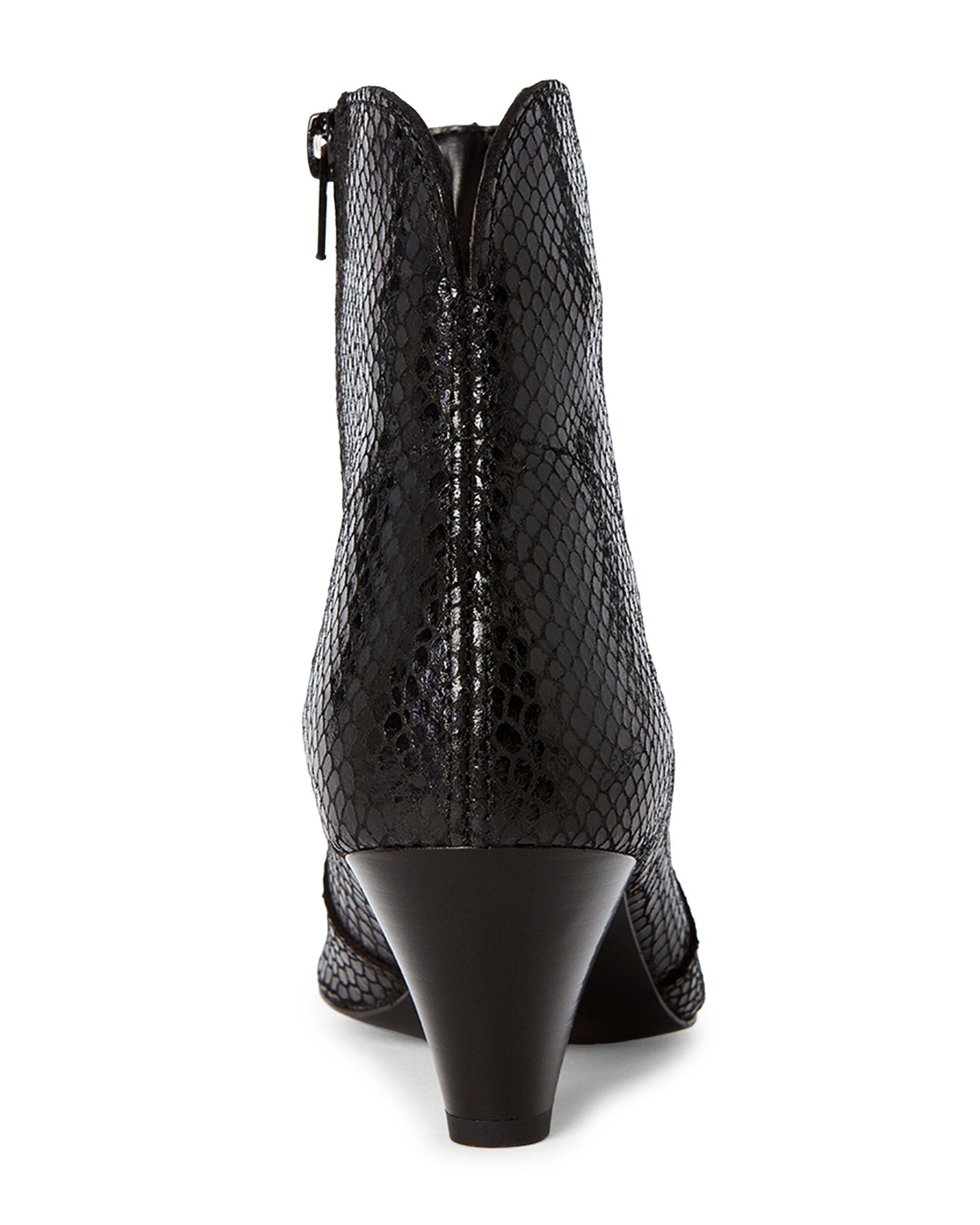 white and black snakeskin booties