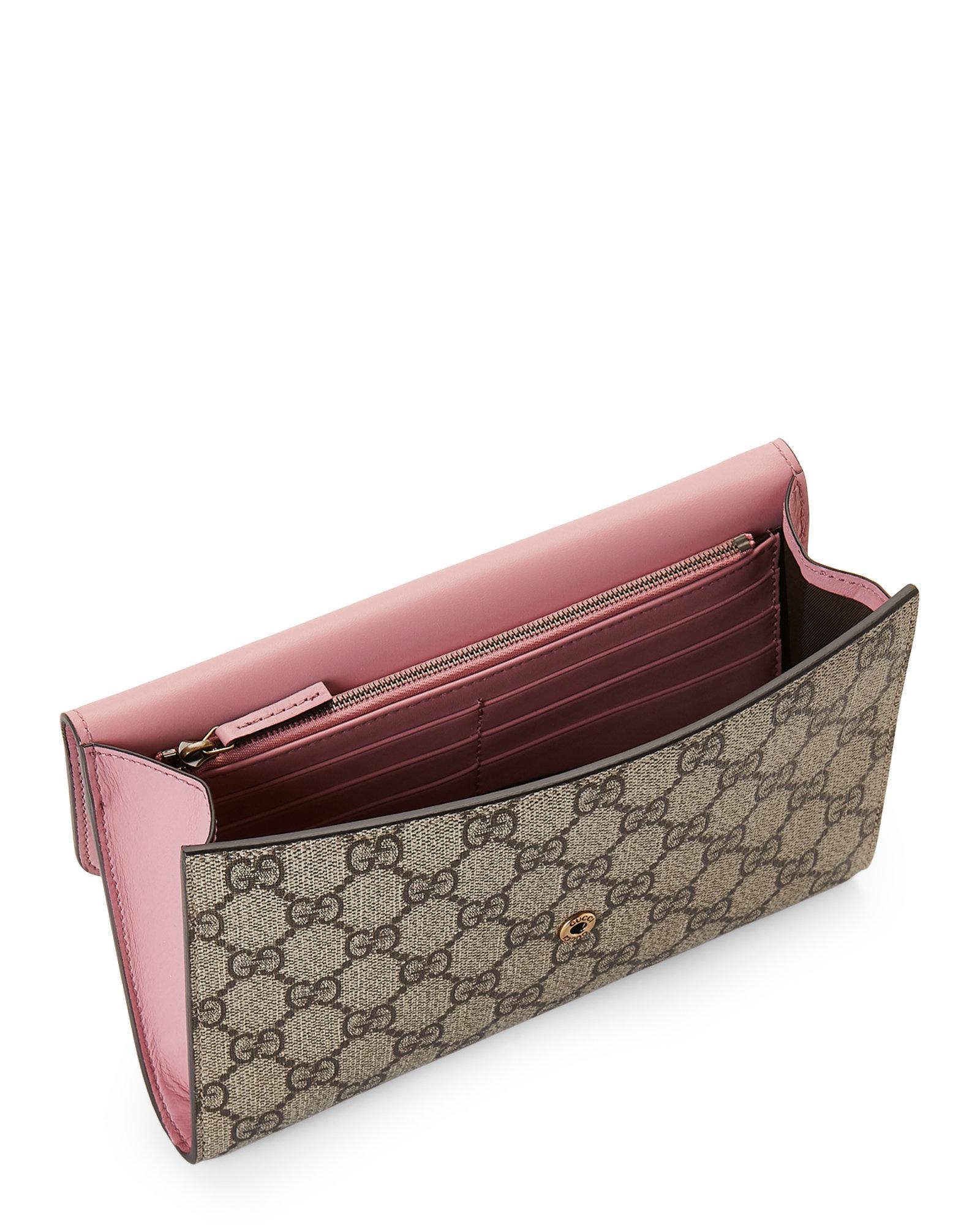 gucci supreme clutch
